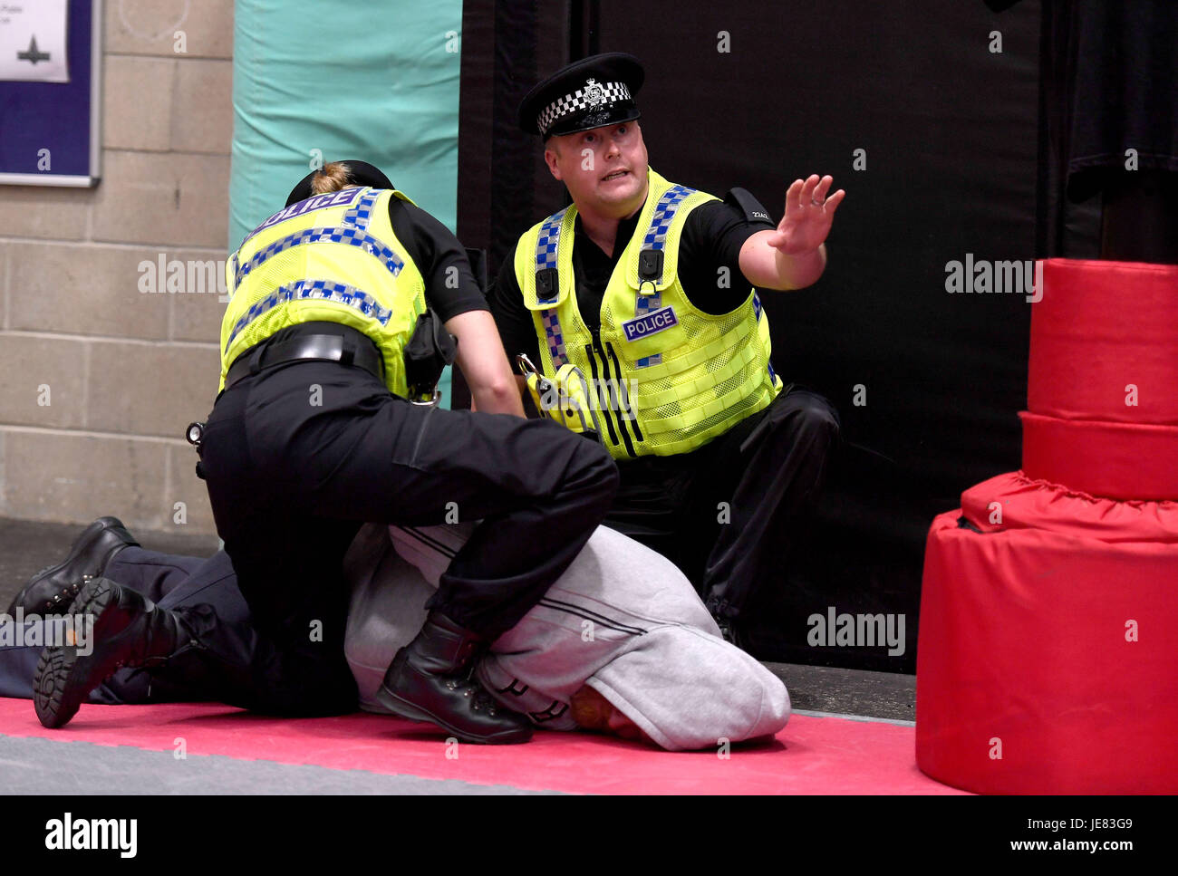 Police demonstrate an arrest during training. The focus of the event is to demonstrate the transparency around Dorset Police's use of force and the challenges involved, along with an overview of equipment and the skills that improve public and officer safety.  This comes ahead of the publication of use of force data by individual police forces nationally at the end of July. Credit: Finnbarr Webster/Alamy Live News Stock Photo