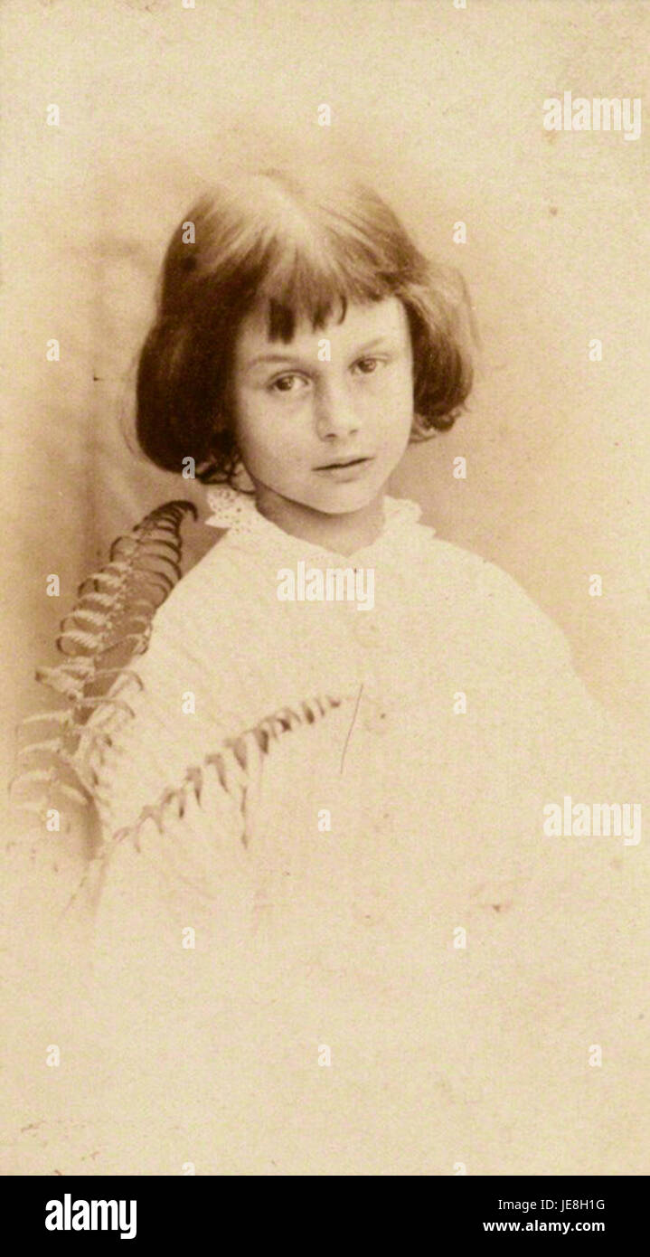 This portrait of Alice Liddell, the inspiration for Lewis Carroll’s 'Alice’s Adventures in Wonderland,' captures her youthful expression and connection to the famous literary work. Stock Photo