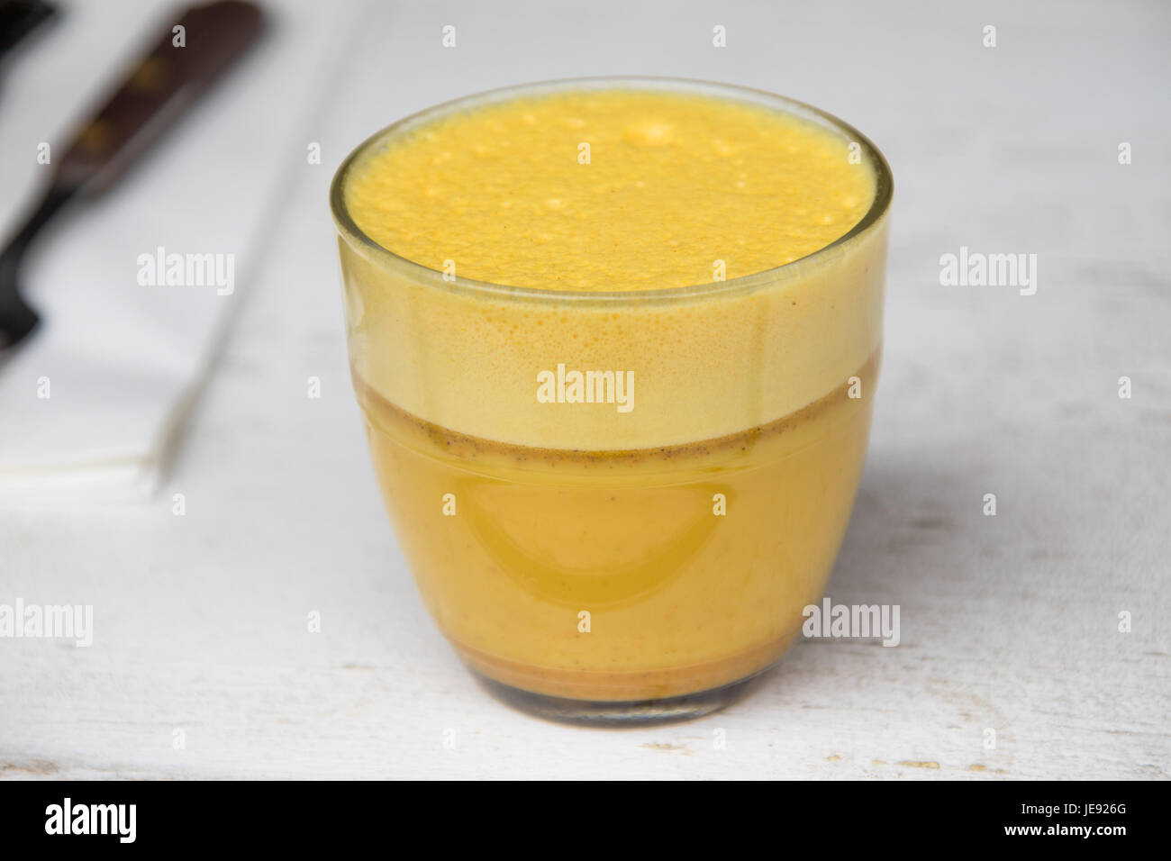 Golden Milk, turmeric, cinnamon and almond milk at 'Post', a small cafe in Alphabet City, East Village, Manhattan, NYC Stock Photo