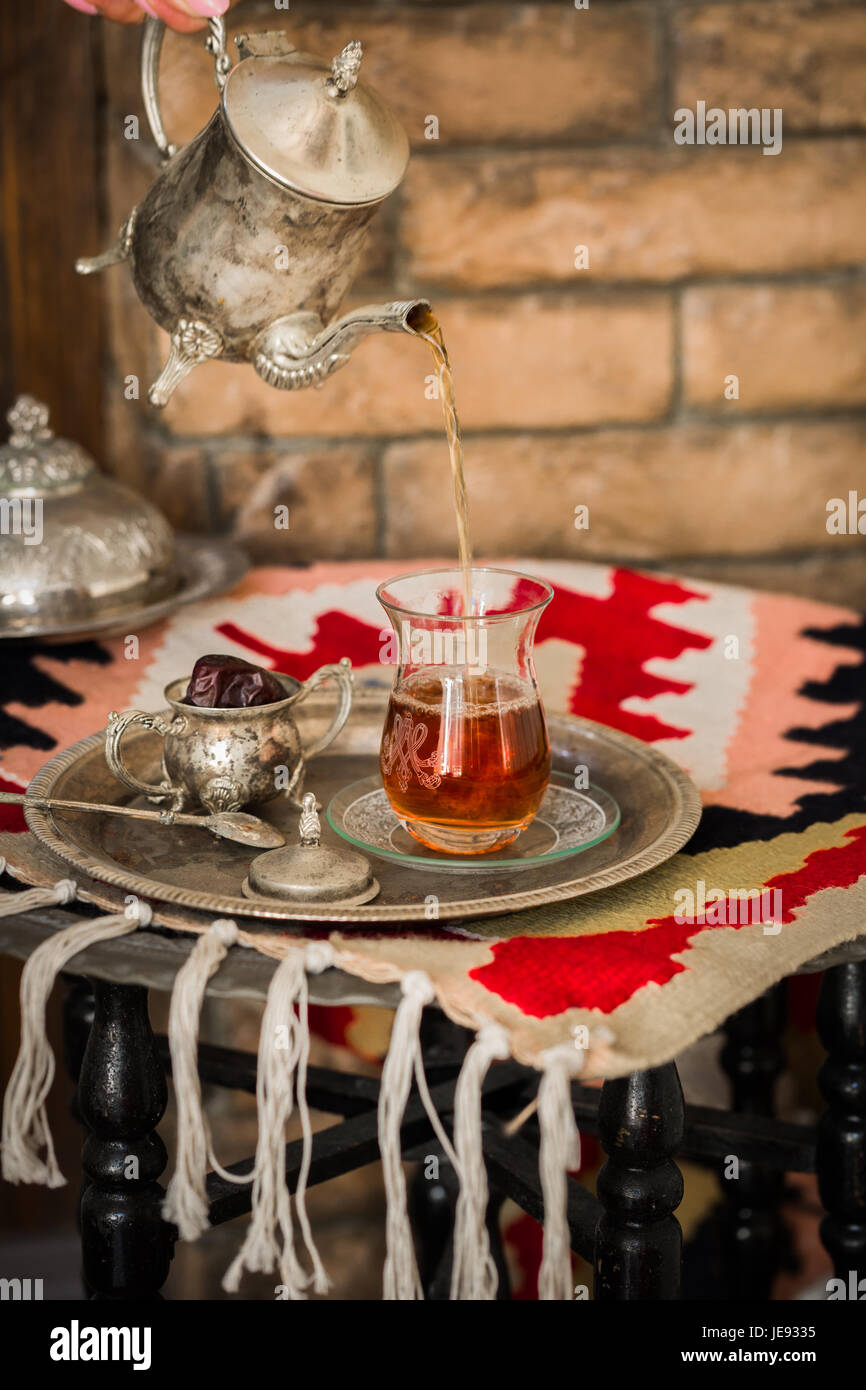 https://c8.alamy.com/comp/JE9335/tea-set-in-oriental-style-in-pear-shaped-glass-with-spoon-and-vintage-JE9335.jpg