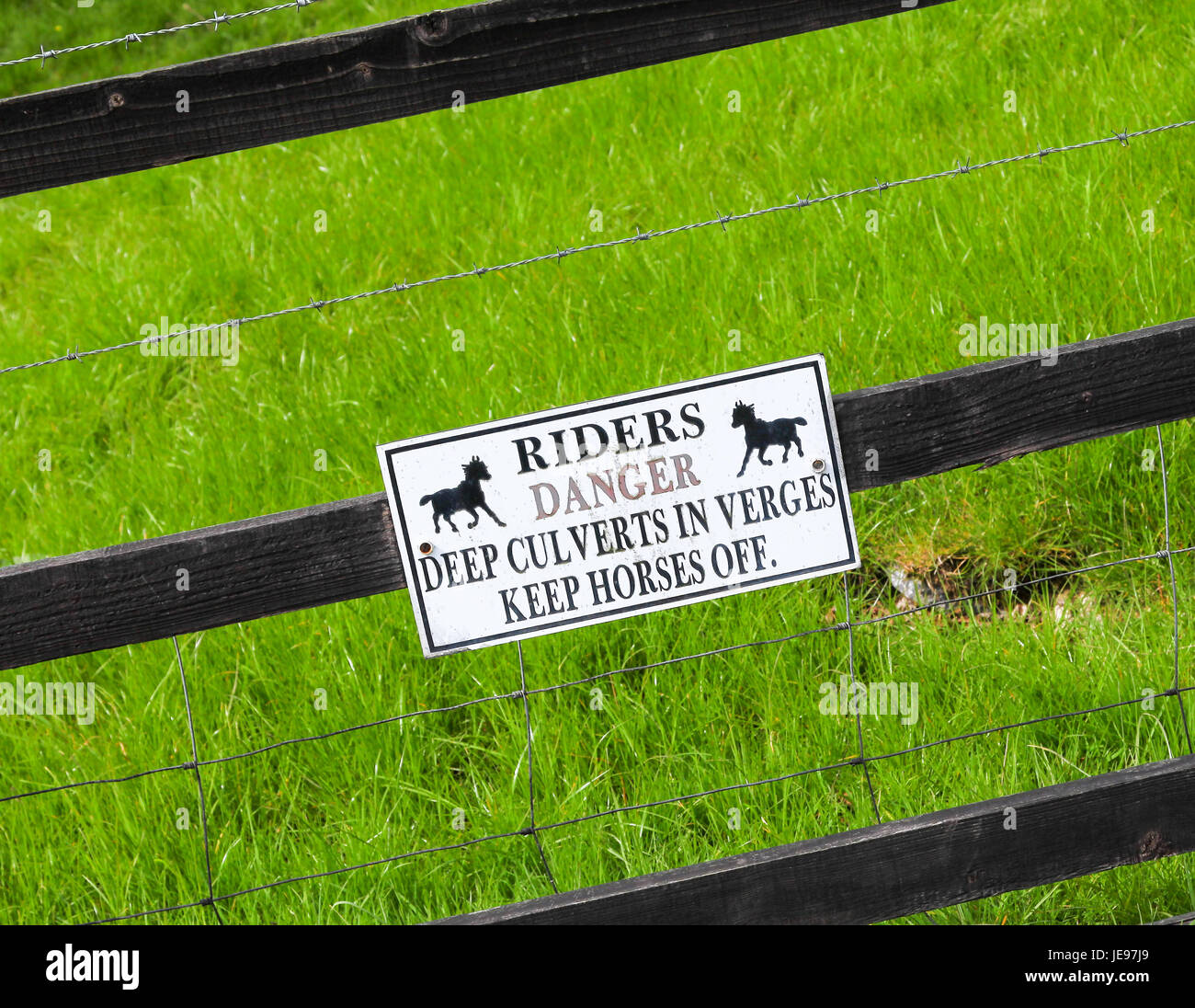 A warning sign saying 'riders danger deep culverts in verges keep