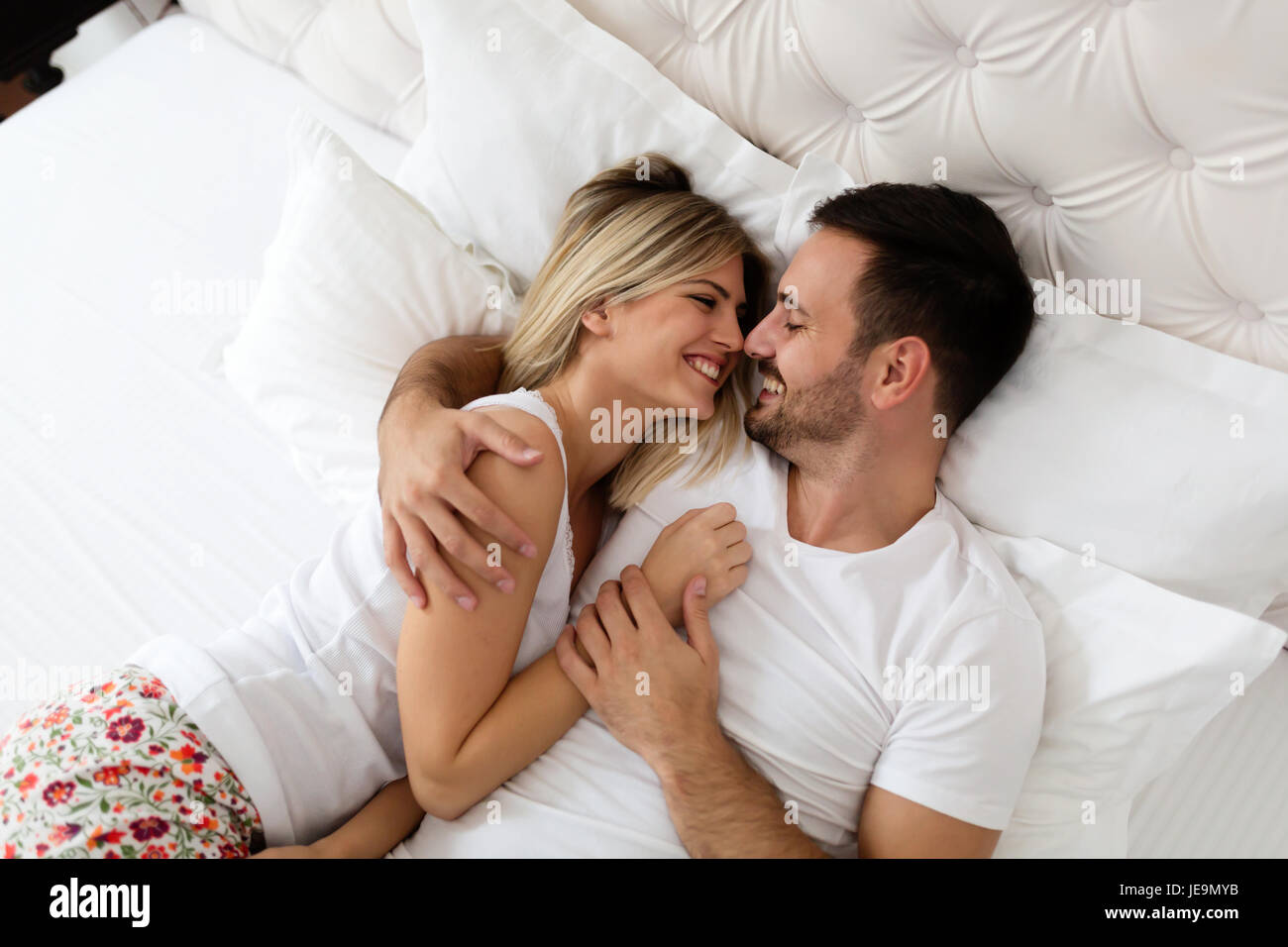 Handsome man and beautiful woman kissing each other Stock Photo