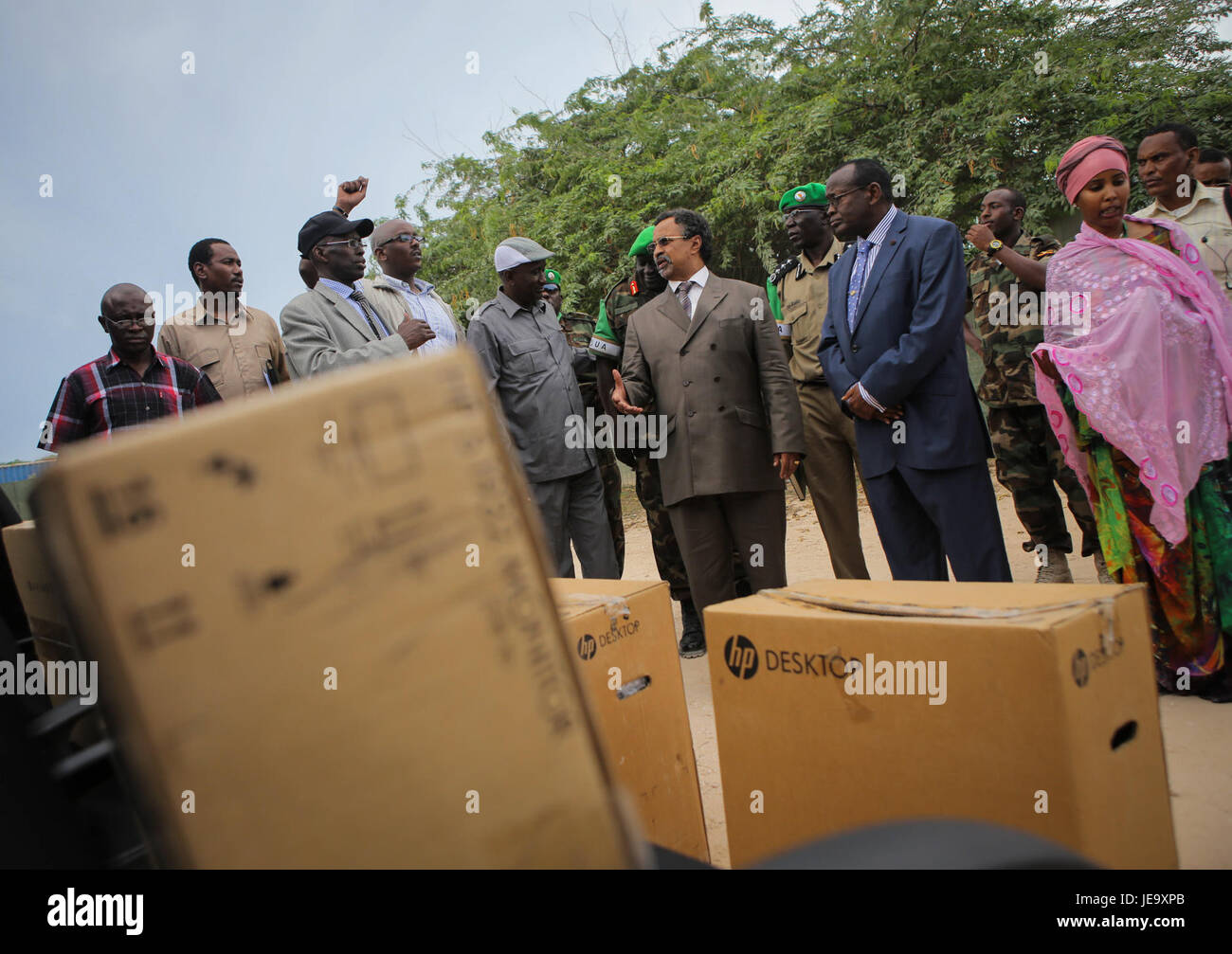 The image captures a formal handover ceremony on April 24, 2013 ...