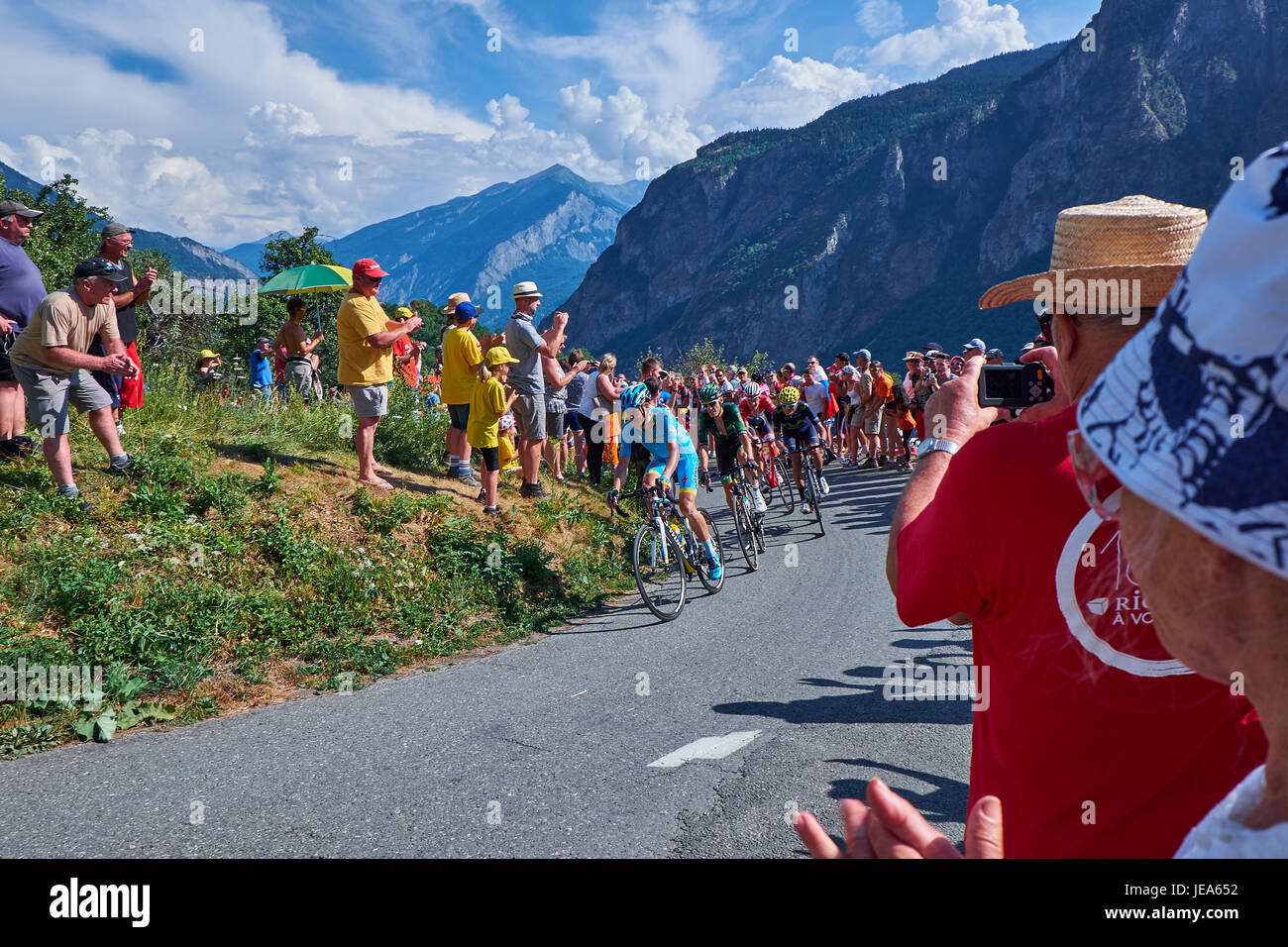 MONTVERNIER, FRANCE - JULY 23, 2015: Danish rider Jakob Fuglsang leading a small group of riders through a hairpin turn on the mountain roads leading  Stock Photo