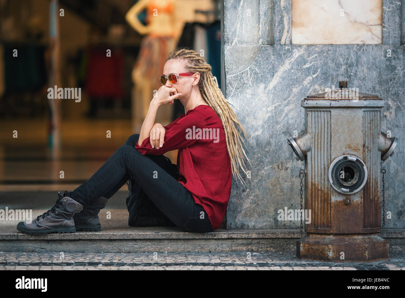Happy young woman blonde dreadlocks hi-res stock photography and
