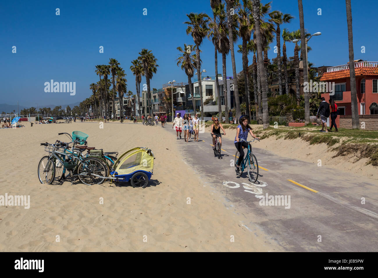 teenage girl, bicycle rider, bicyclist, bicycling, bike trail, bicycle trail, bike path, bicycle path, Venice Beach, Venice, Los Angeles, California Stock Photo