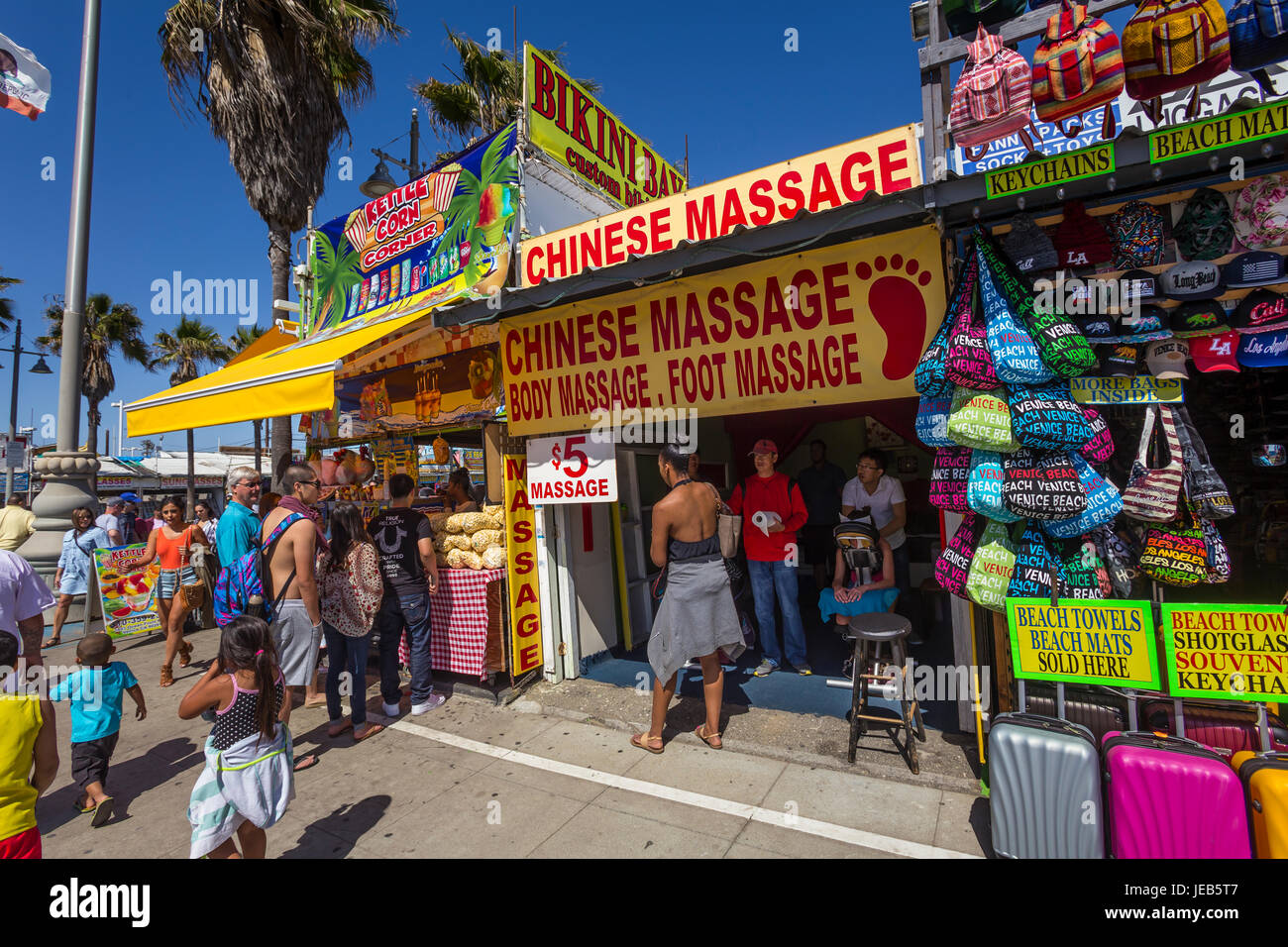 people, tourists, Chinese massage, Chinese body massage, Chinese foot massage, shops, Ocean Front Walk, Venice Beach, Venice, Los Angeles, California Stock Photo