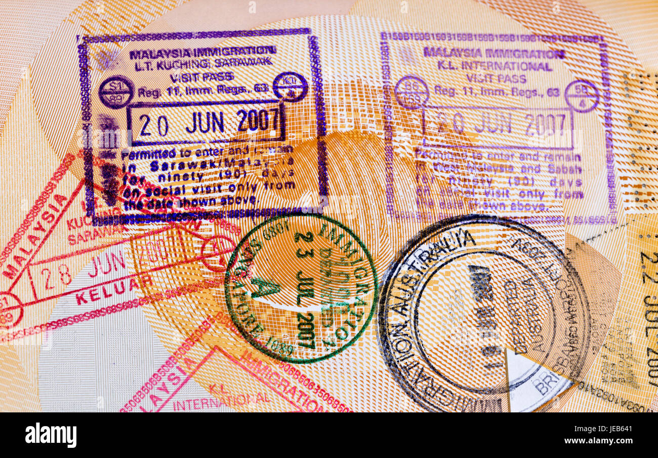 Various arrival and departure stamps on a passport Stock Photo Alamy