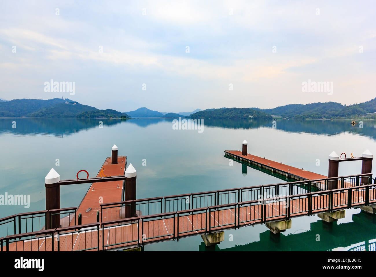 Long exposure of harbor with boats in the morning time at Sun Moon Lake, Nantou city, Taiwan Stock Photo