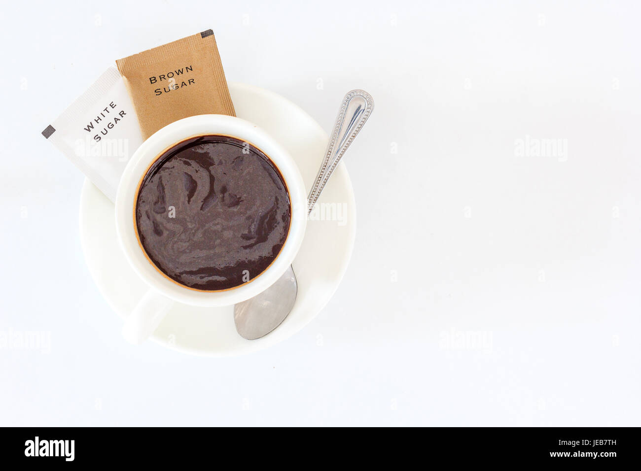 A cup of black coffee and sugar sachet for refreshing in the morning