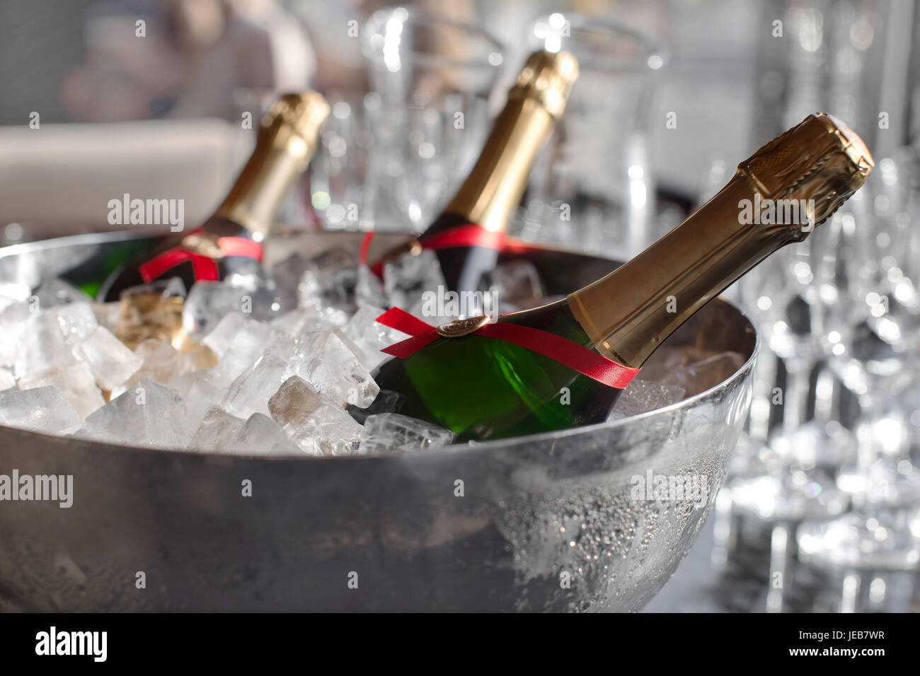 Three wine bottles chill in ice bucket Stock Photo Alamy