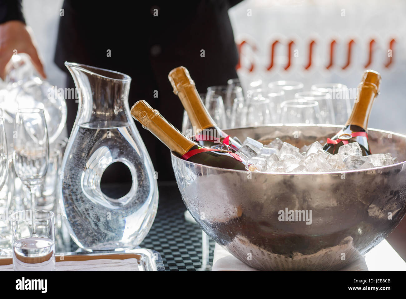 Three wine bottles chill in ice bucket Stock Photo