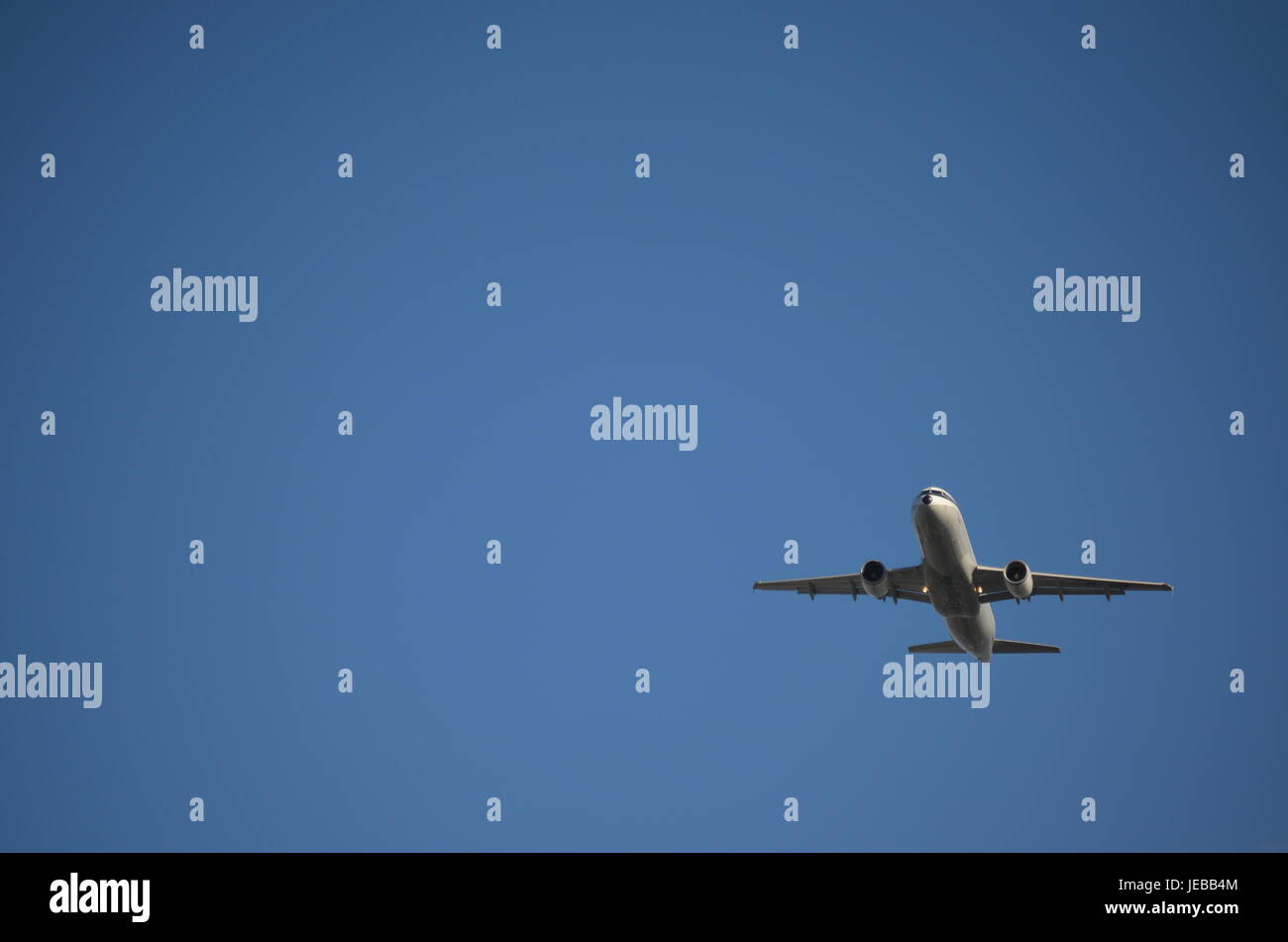 Commercial Airplane Flying Upwards Stock Photo