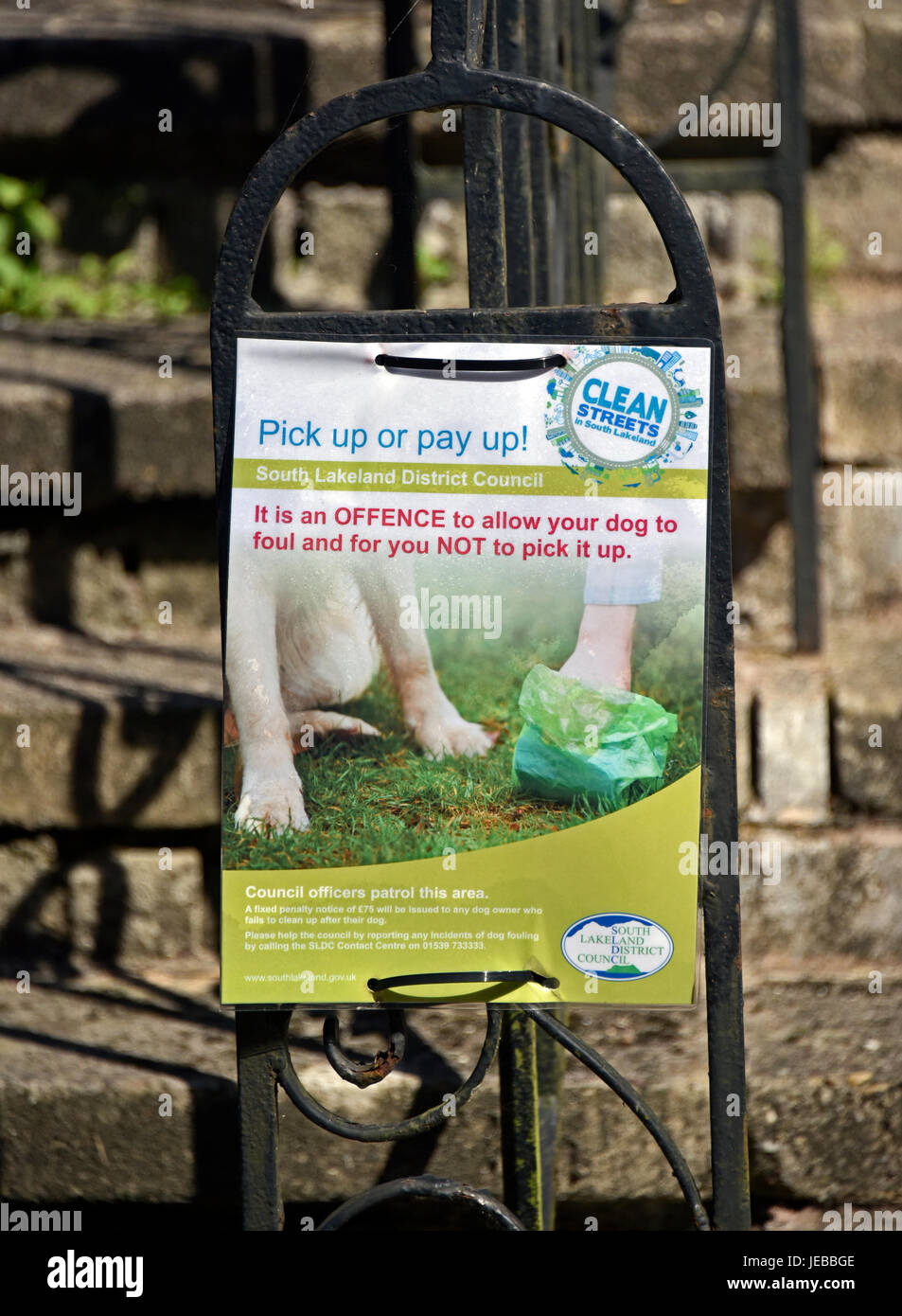 South Lakeland District Council sign re dog fouling . "Pick up or pay up!". Fellside, Kendal, Cumbria, England, United Kingdom, Europe. Stock Photo