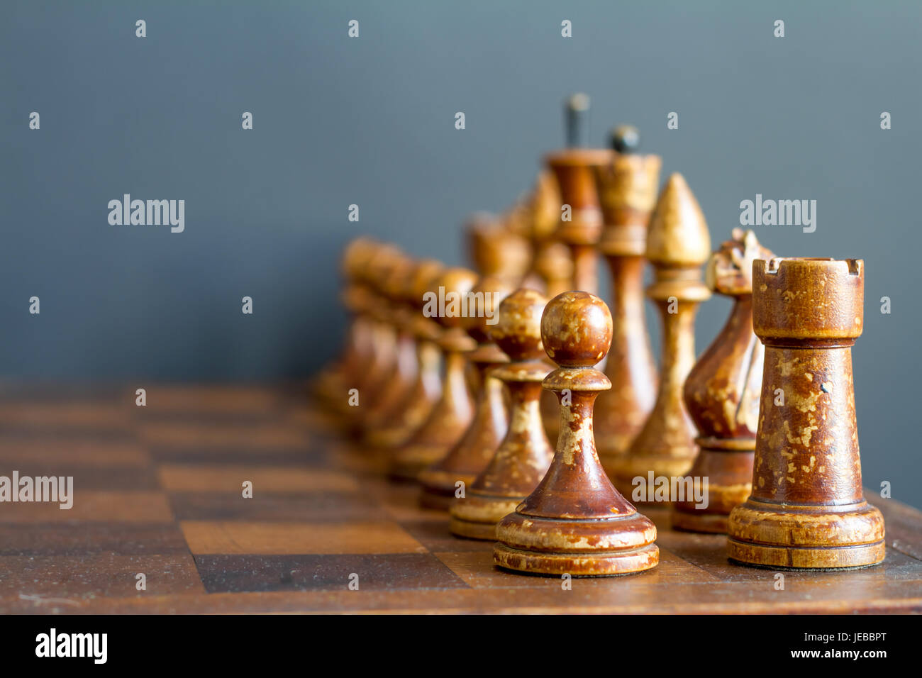 Ancient wooden chess pieces on an old chessboard Stock Photo - Alamy