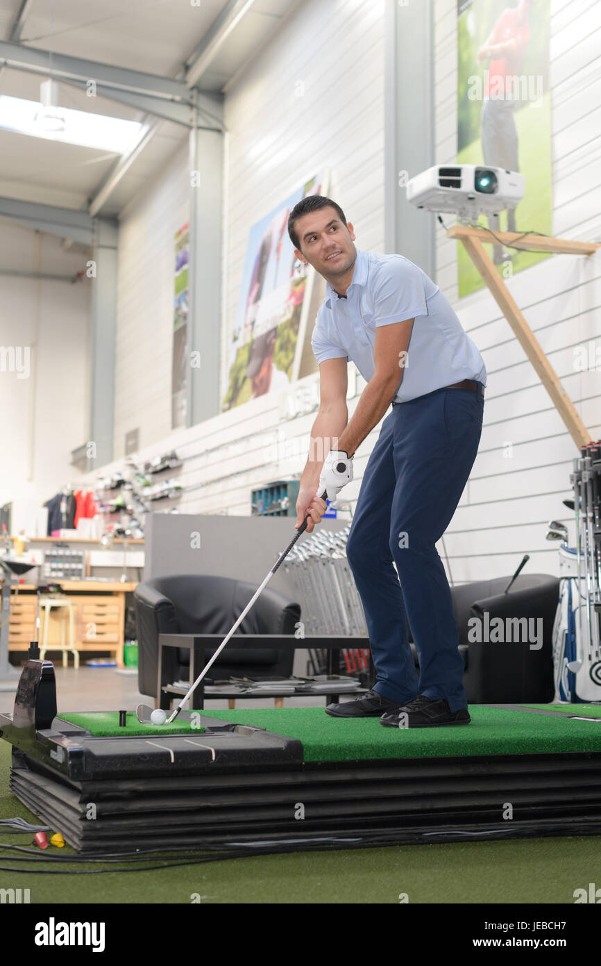 businessman playing mini golf in his office Stock Photo