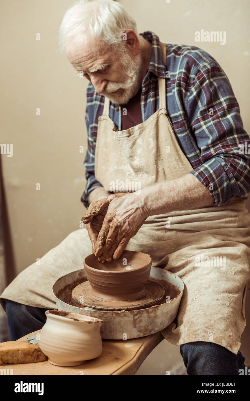 Close up of male craftsman working on potters wheel Stock Photo