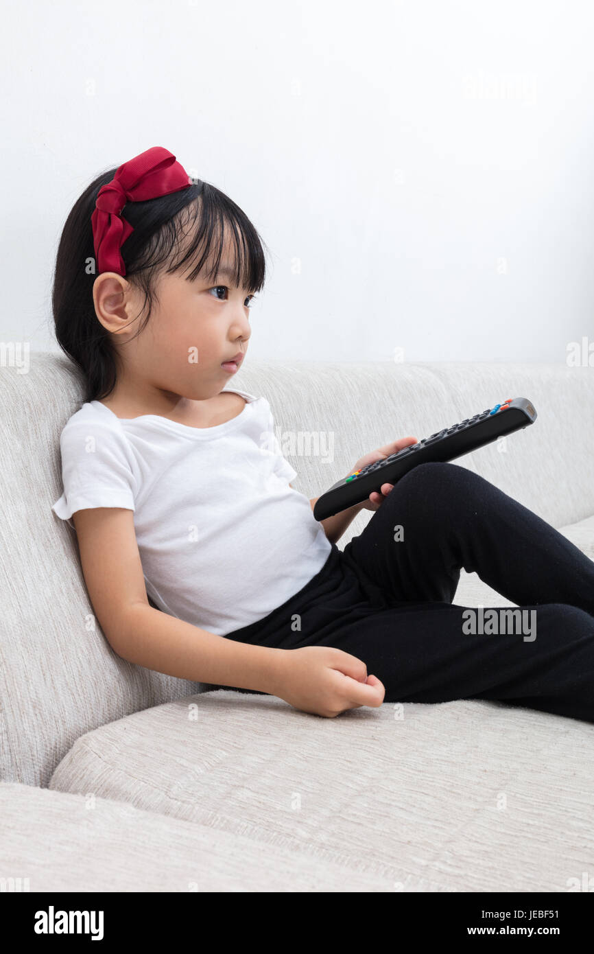 Girl holding a tv remote hi-res stock photography and images - Alamy