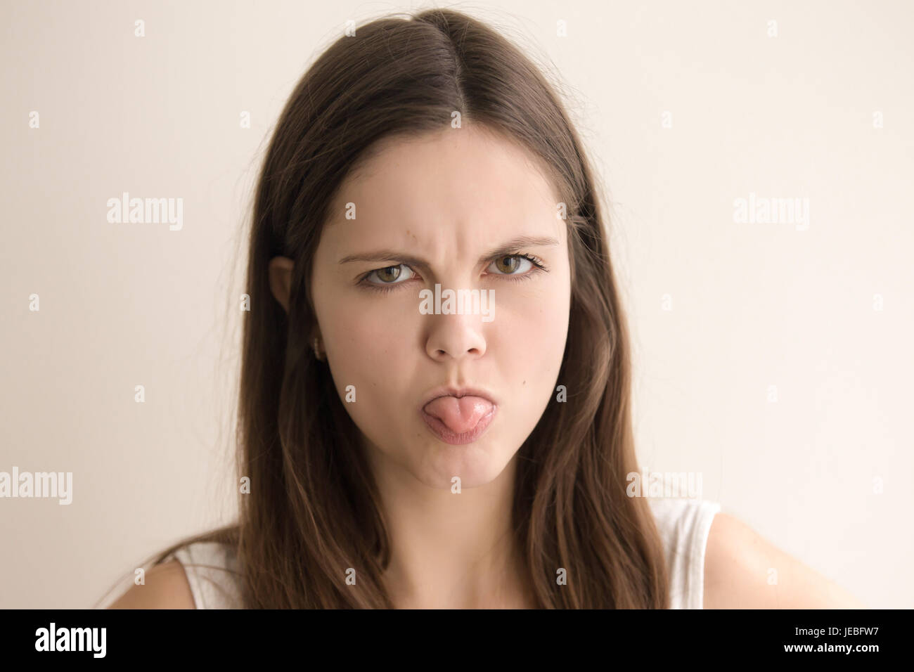 Emotive headshot portrait of offended young woman Stock Photo