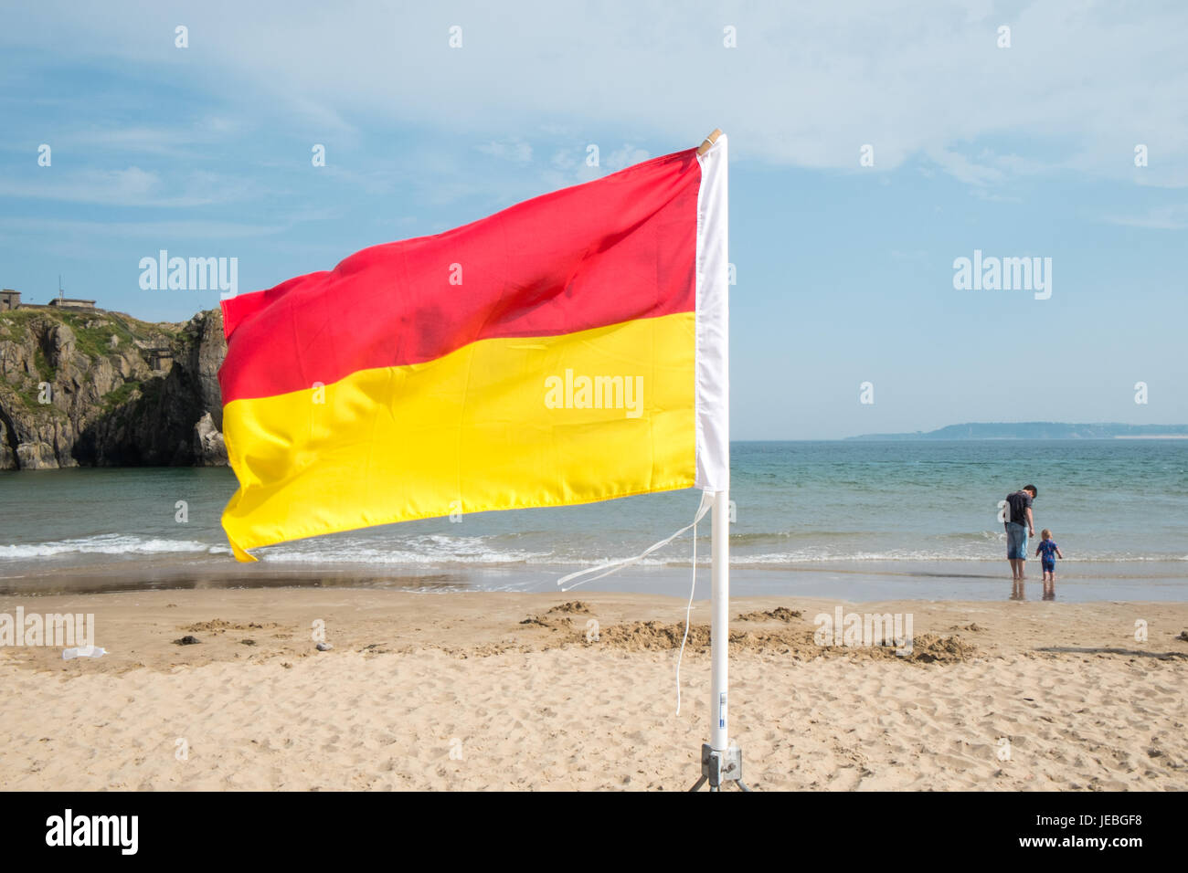 RNLI,lifesaver,flag,flags,protected,protection,life guard,area,for,swimming,saving,lives,South,Beach,Tenby,Pembrokeshire,West,Wales,U.K.,UK,GB,Europe, Stock Photo