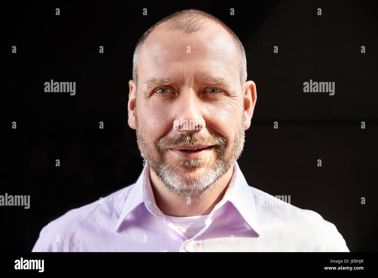 Mature man in black clothing hi-res stock photography and images - Alamy