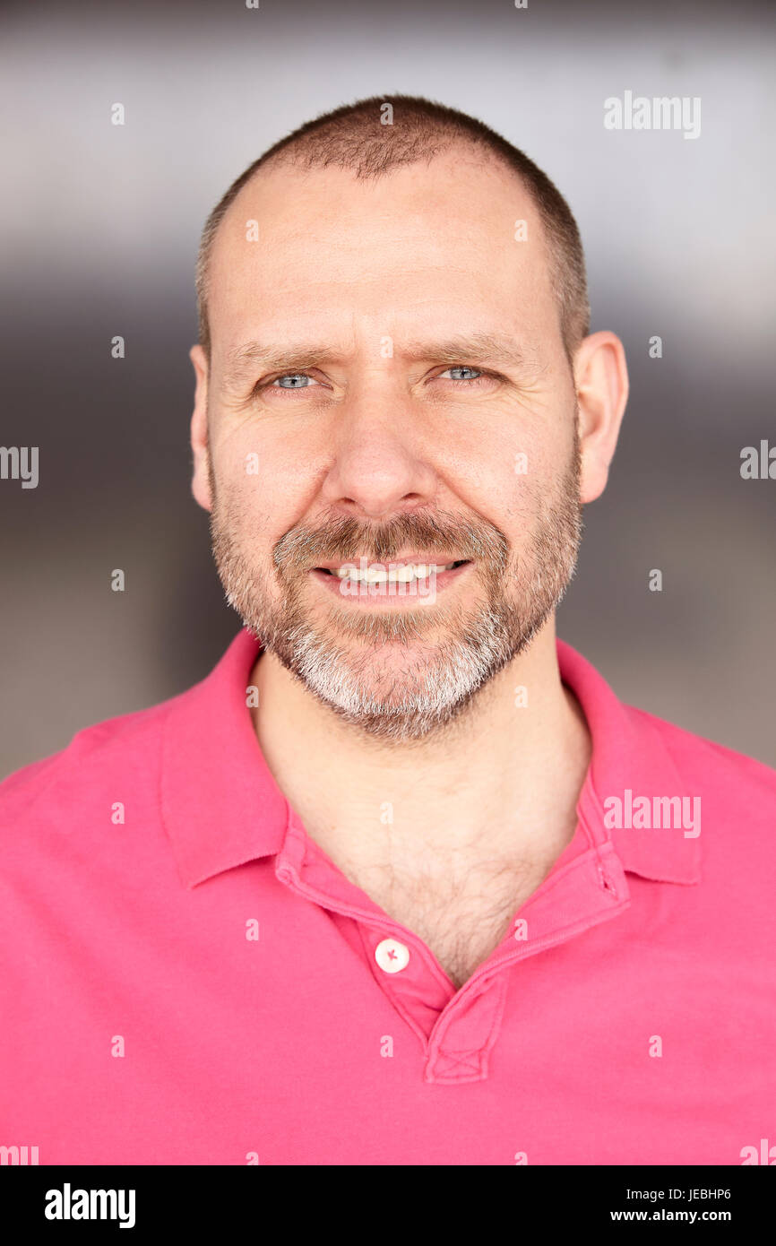 Man in pink t shirt hi-res stock photography and images - Alamy