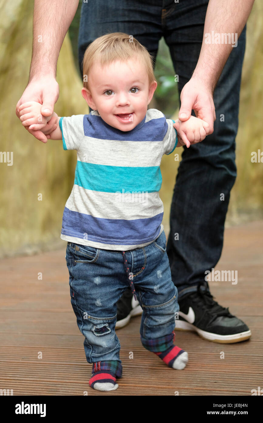 baby boy learning to walk Stock Photo