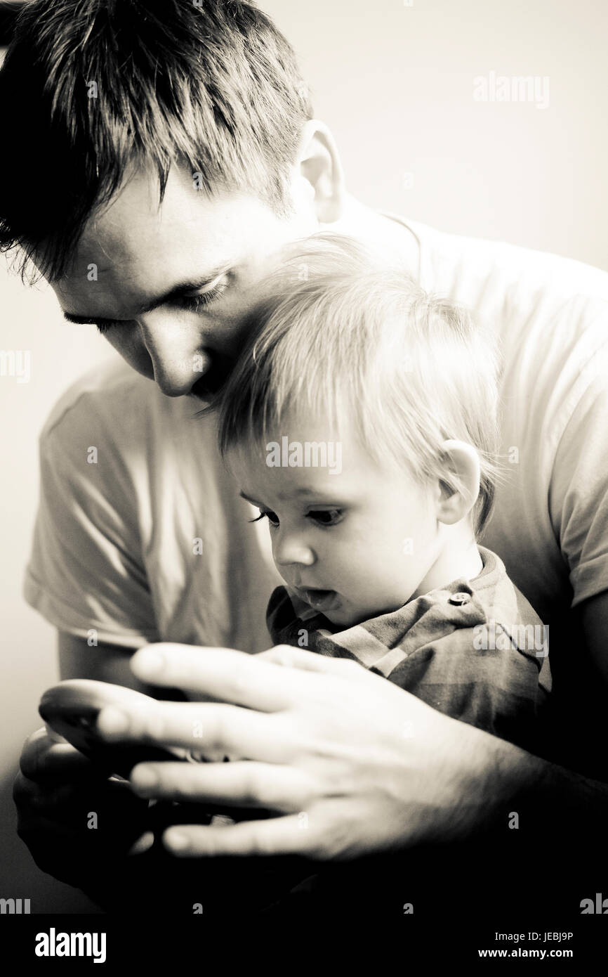 intimate moment between father and baby boy Stock Photo