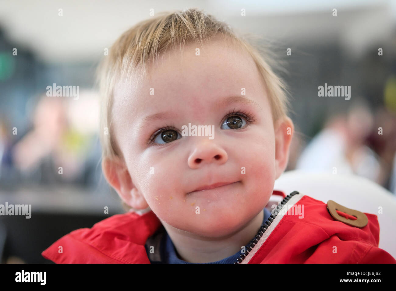 baby boy in red coat Stock Photo Alamy
