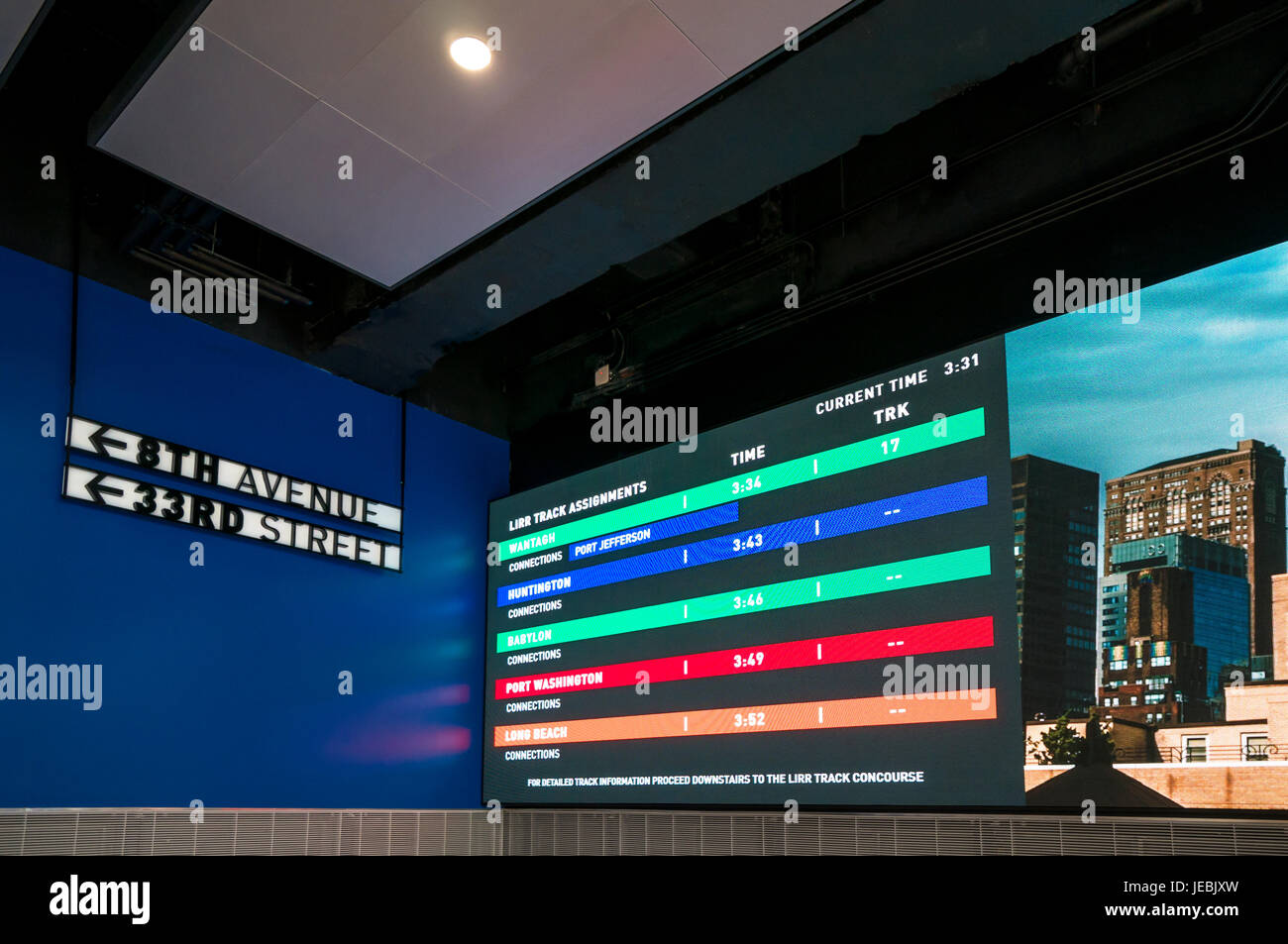 Penn Station's new look with modern improvements shows a schedule display in colors Stock Photo