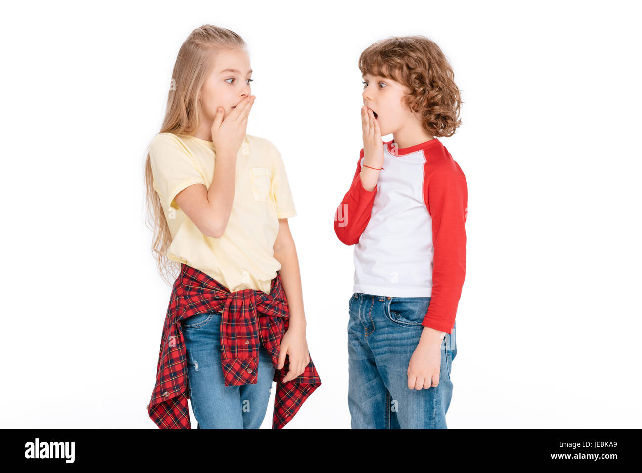 Surprising boy and girl with shocked expression isolated on white Stock Photo