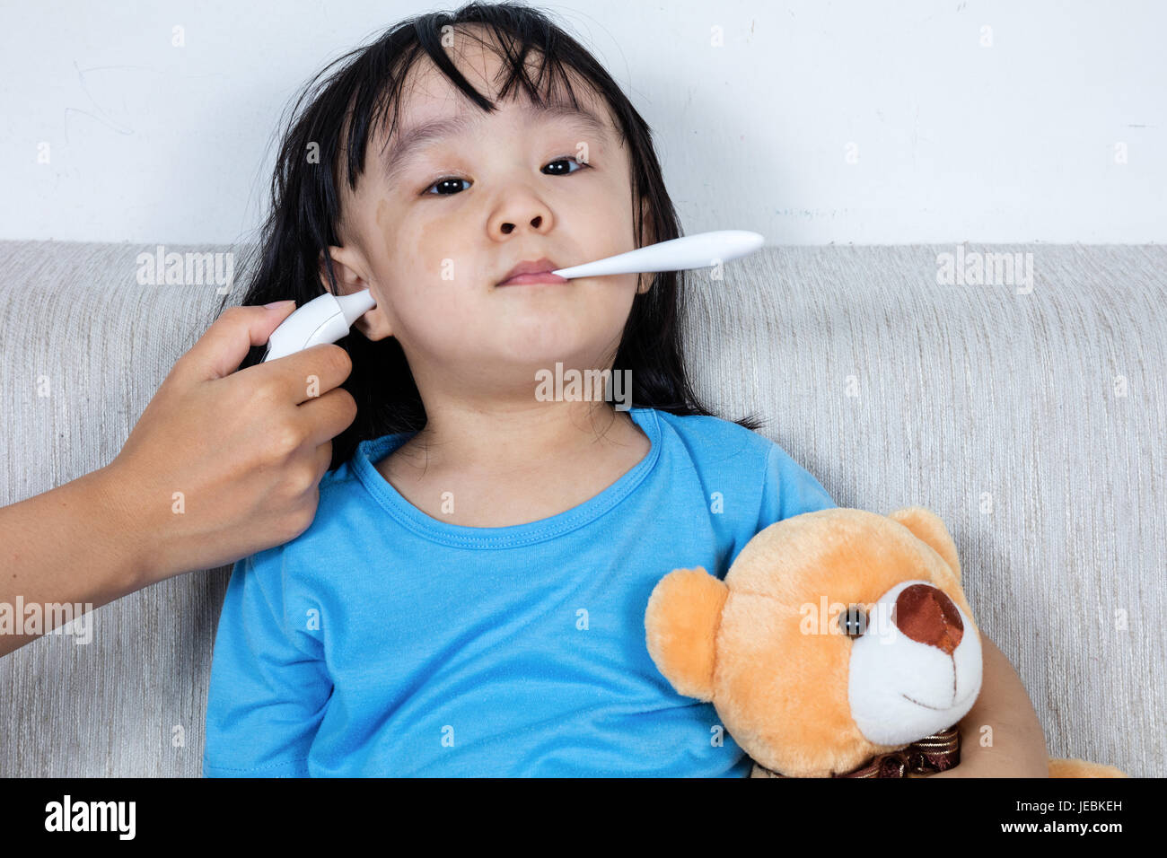 Ear temperature child asian hires stock photography and images Alamy
