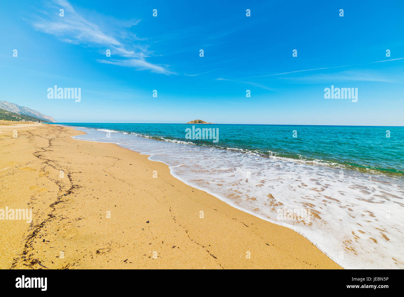 blue sea and golden shore in Is Orrosas beach Stock Photo - Alamy