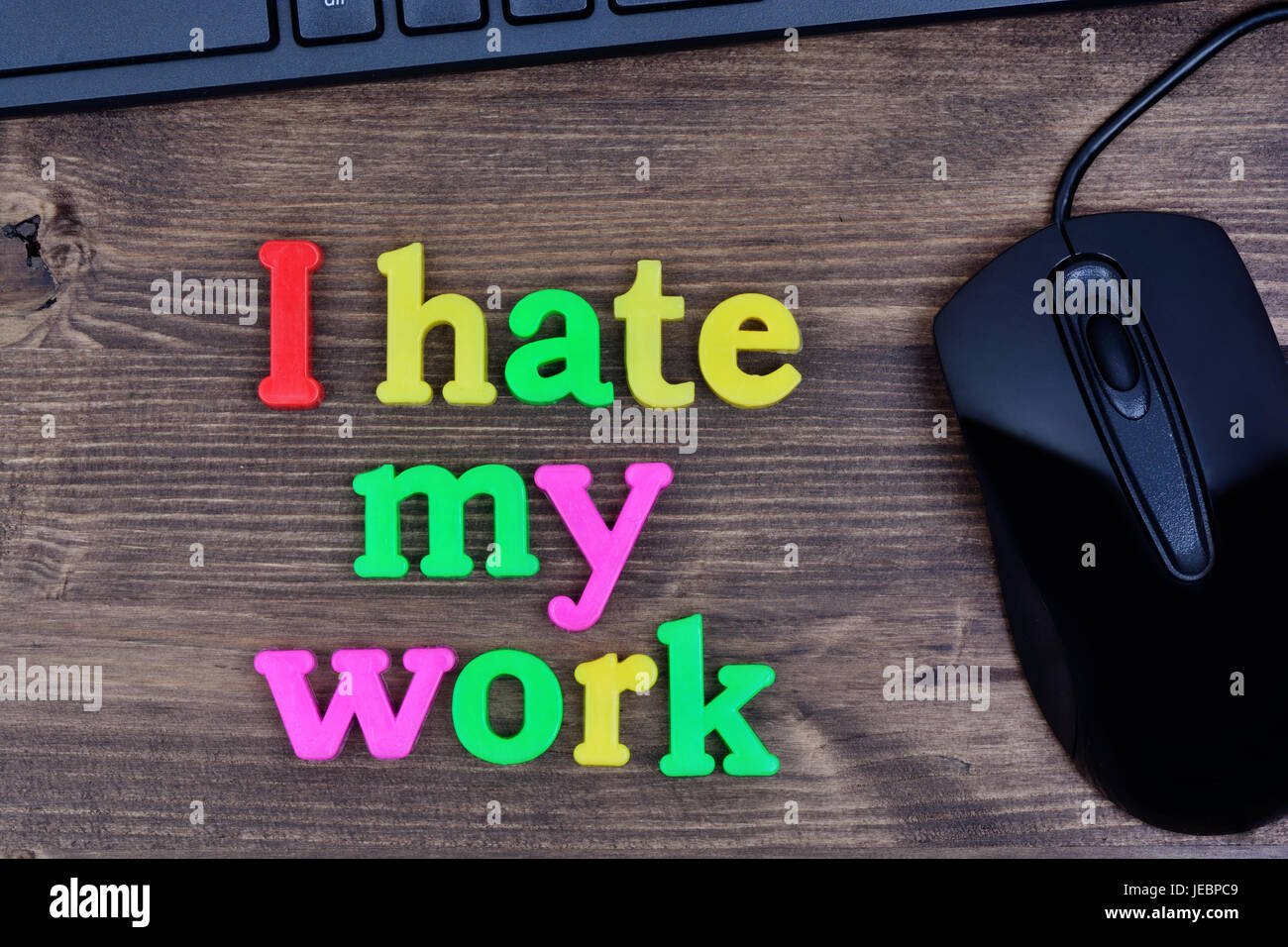 I hate my work words on wooden table Stock Photo