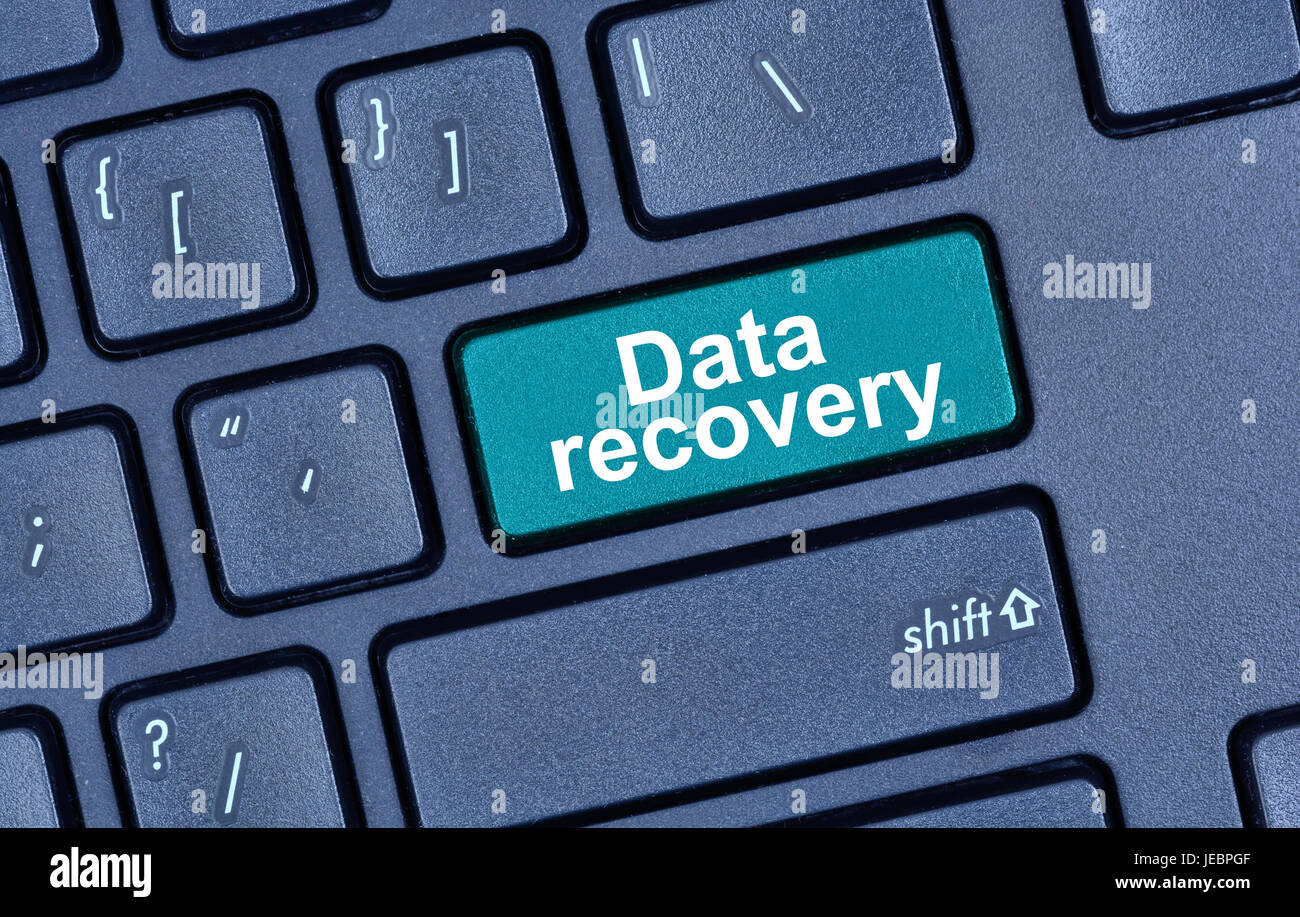 Data recovery words on keyboard button pc Stock Photo