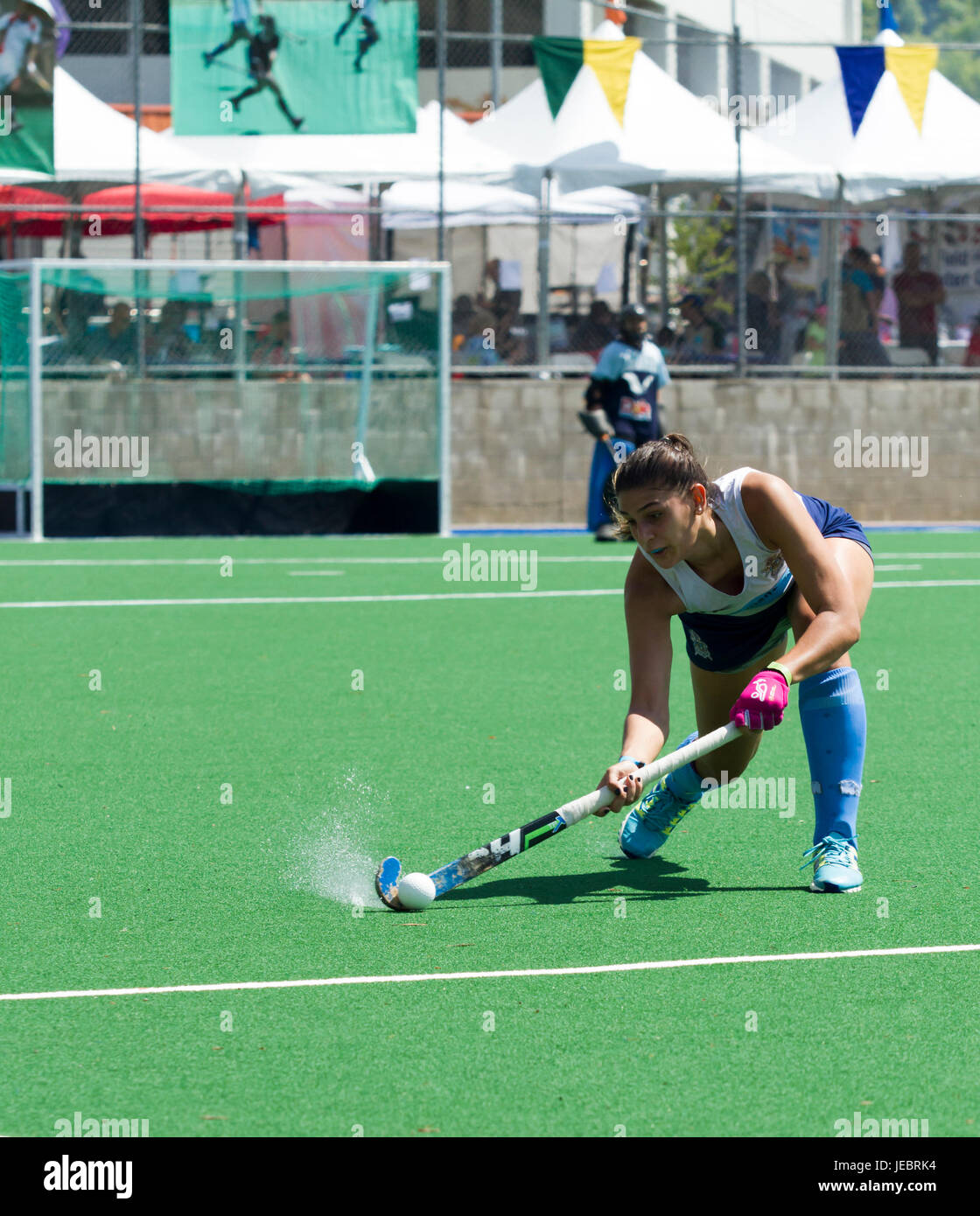 Female field hockey player drives the puck down field- Argentina vs. The Olympic Club in the 2017 California Cup, Moorpark College Stock Photo