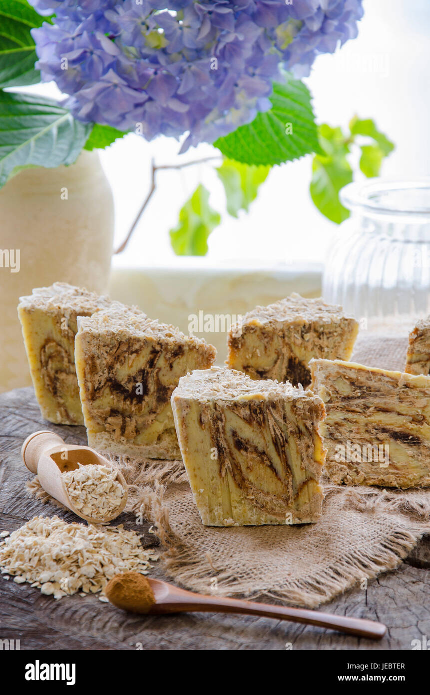 homemade oats and cinnamon soap using olive oil shea and cocoa butter Stock Photo