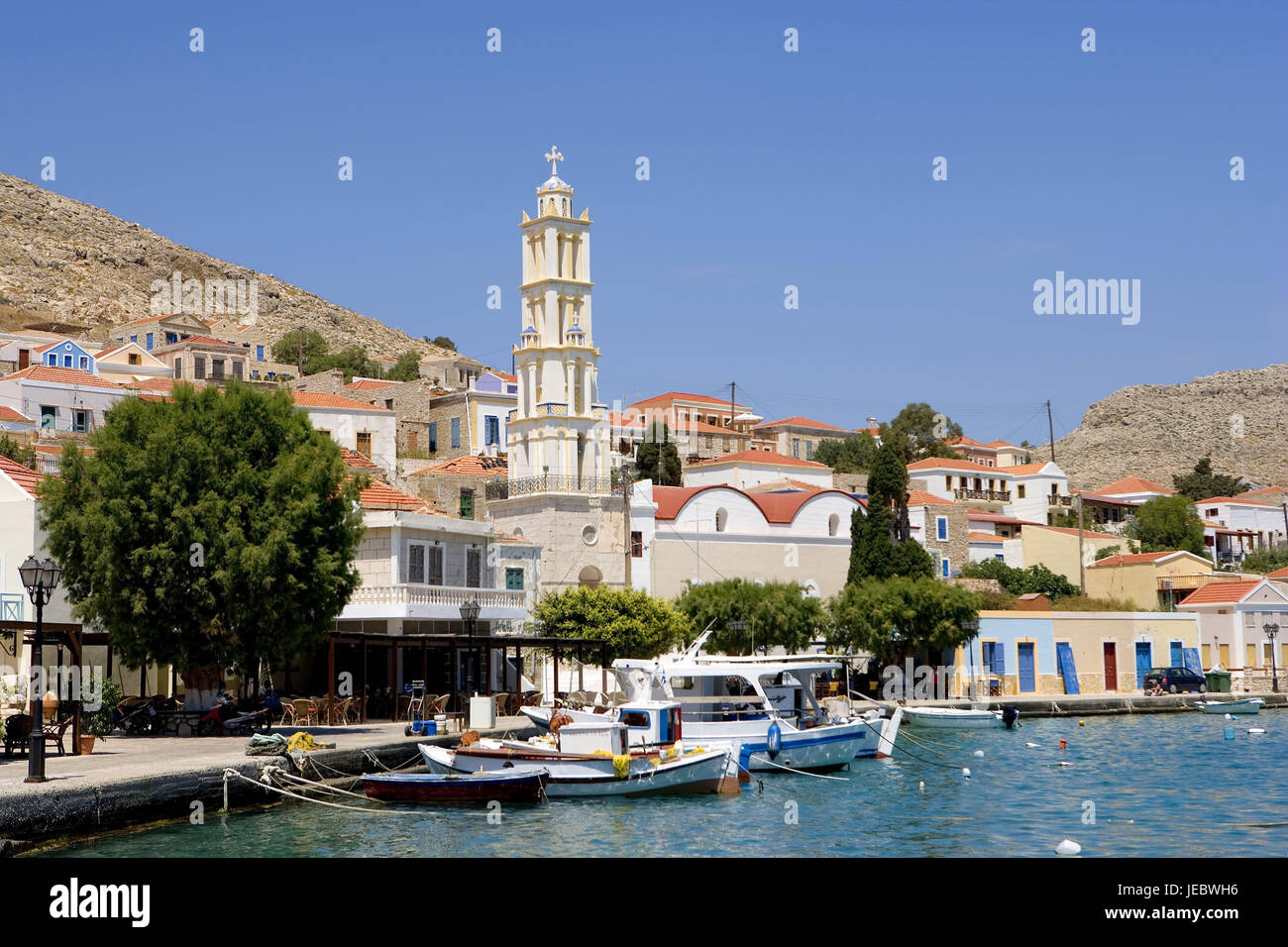 Greece, island Chalki, principal place Emborio, harbour view, clock ...