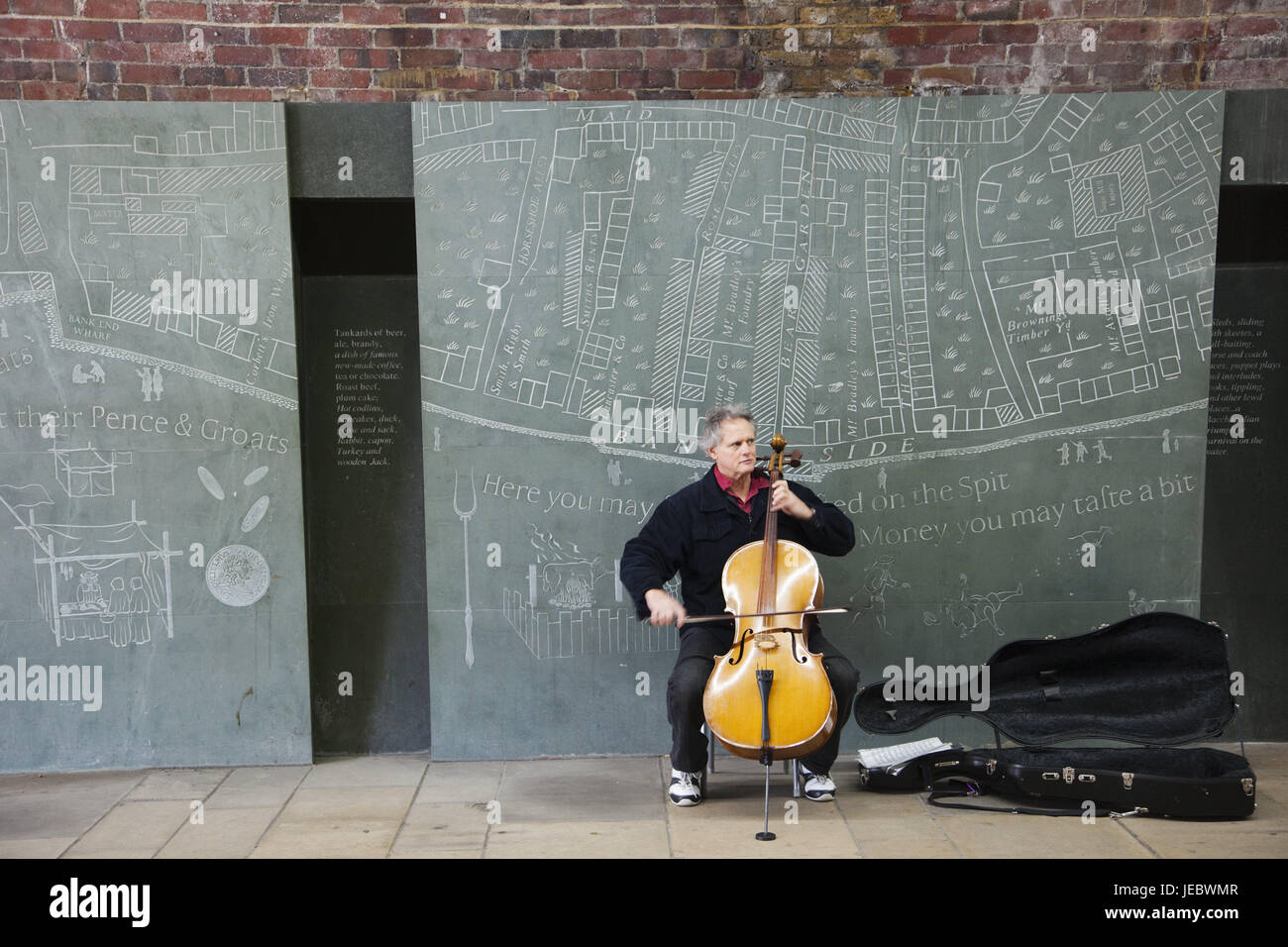 England, London, Southbank, street musician, UK, GB, Bankside, street, music, musician, person, man, cello, musical instrument, defensive wall, brick defensive wall, brick, hobby, leisure time, Stock Photo