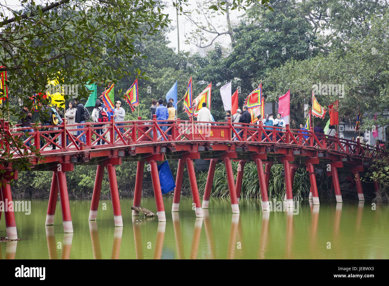 Vietnam, Hanoi, Hoan Kiem lake, Huc bridge, passer-by, Stock Photo