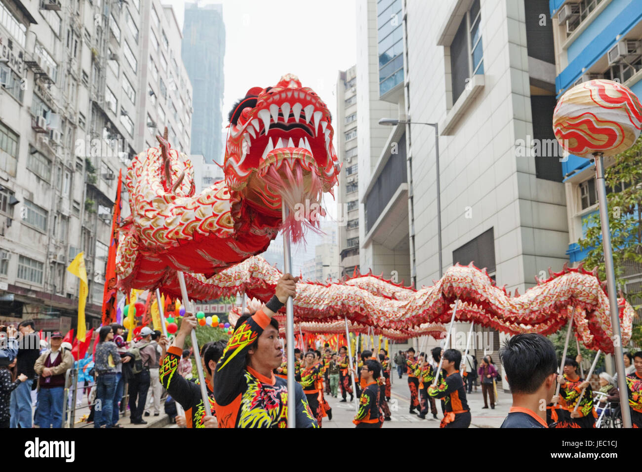 China, Hong Kong, dragon's dance, men, tradition, mass, tourism, save, dragon's dance, dance, culture, paper dragon, dragon, in Chinese, cogs, bite, person, young, tourists, Stock Photo