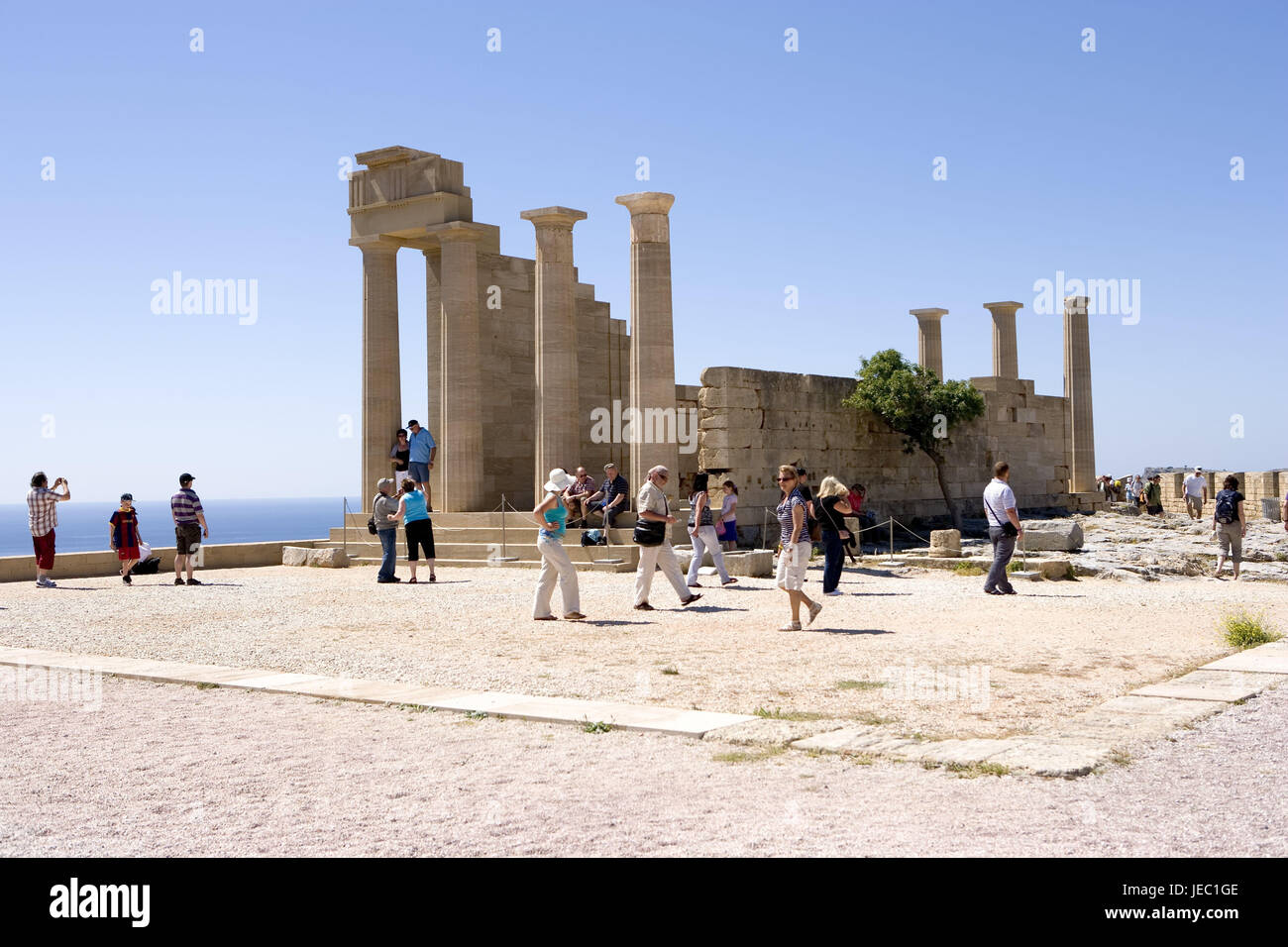 Greece, Rhodes, Lindos, Athena Lindia temple, tourist, reconstruction, temple, pillars, Rhodes, Acropolis, reconstruction, place of interest, person, tourism, sea, view, Stock Photo