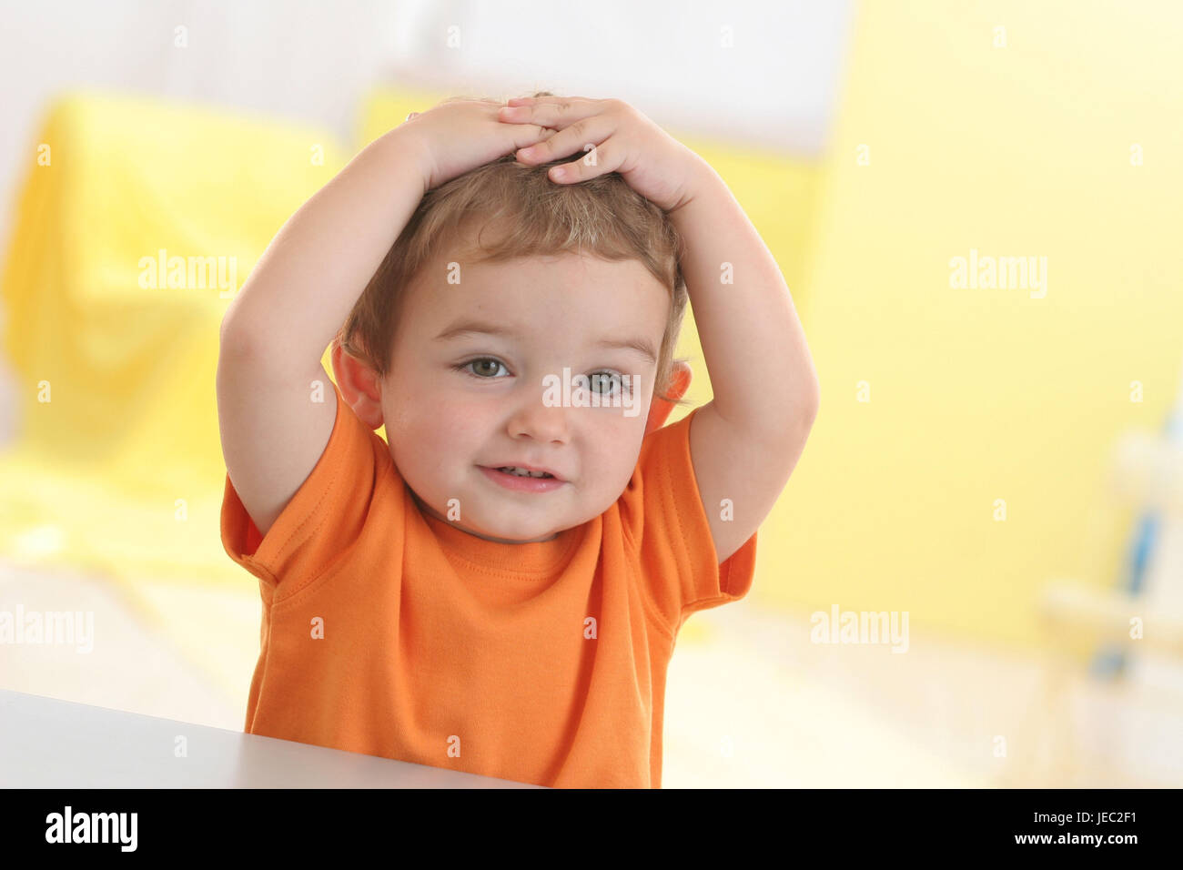 Infant, 2 years, play, gesture, hands on the head, portrait, Stock Photo