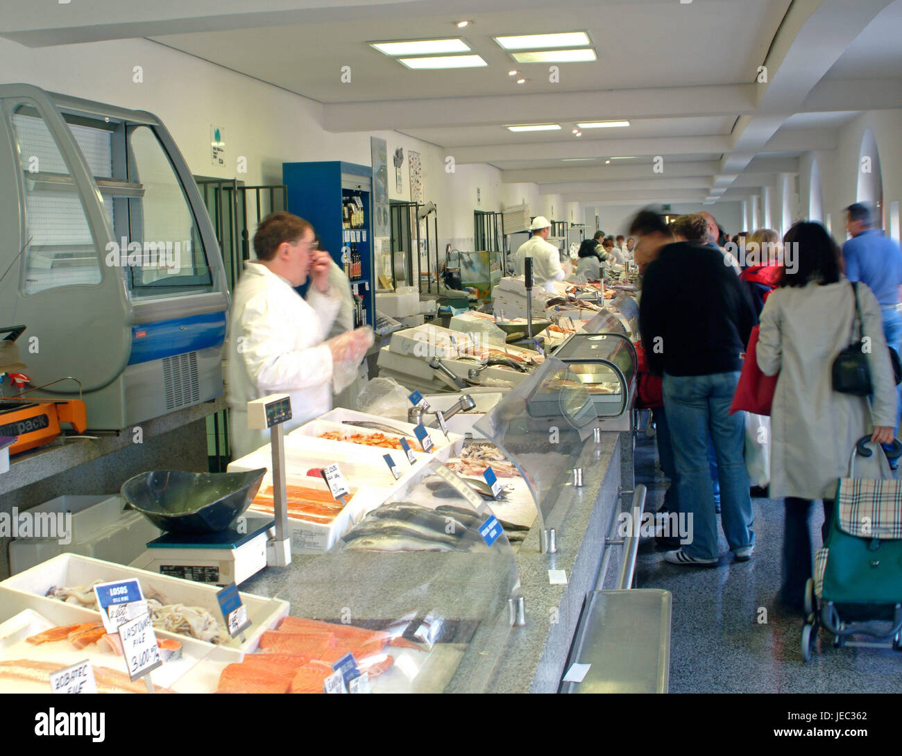 View in a covered market with sales booths of the fish sellers in Ljubljana, Stock Photo