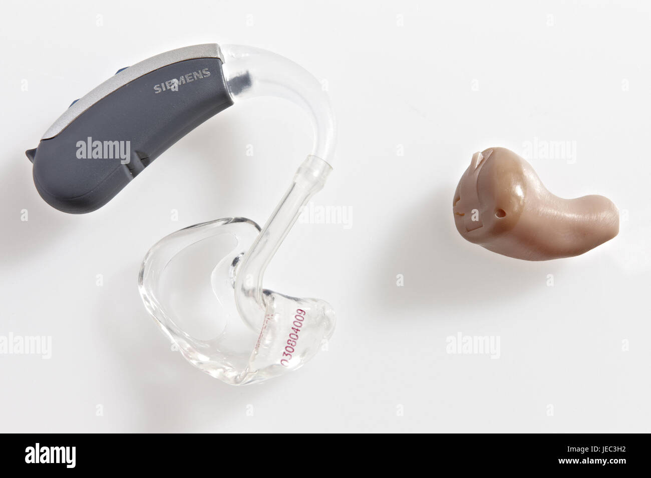 Hearing aids, differently, in ear device, Hinter-dem-Ohr-Gerät, two, analogously, accessory, everyday coping, hearing impairment, support, help, hear, hearing-injured, hearing, severe bondage, hard of hearing, medical device, object photography, studio, Otoplastik, hearing help, impediment, hearing aid Stock Photo