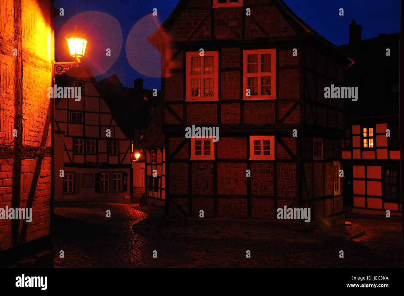 Germany, Saxony-Anhalt, Quedlinburg, half-timbered houses, finch focus, lane, dusk, illuminateds, Stock Photo