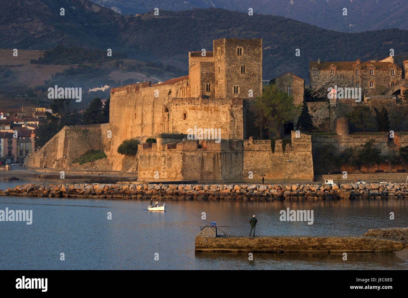 Europe, France, Collioure, view at the château royal, Europe, France, Languedoc-Roussillon, Collioure, Département of Pyrénées-East ale, tag, colour picture, person in the background, angler, catch, architecture, building, structure, structures, lock, locks, traditional culture, waters, water, sea, the Mediterranean Sea, scenery, sceneries, coast, coastal scenery, coastal sceneries, coasts, ocean, oceans, geography, travel, destination, holiday destination, tourism, tourism, parish, parishes, place, places, town, towns, town view, town views, shore, king's castle, castle, castles, fortress, Stock Photo