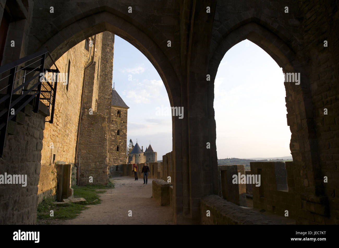 France, region Aude, Carcassonne, archway in the fortress, people in the background, Stock Photo