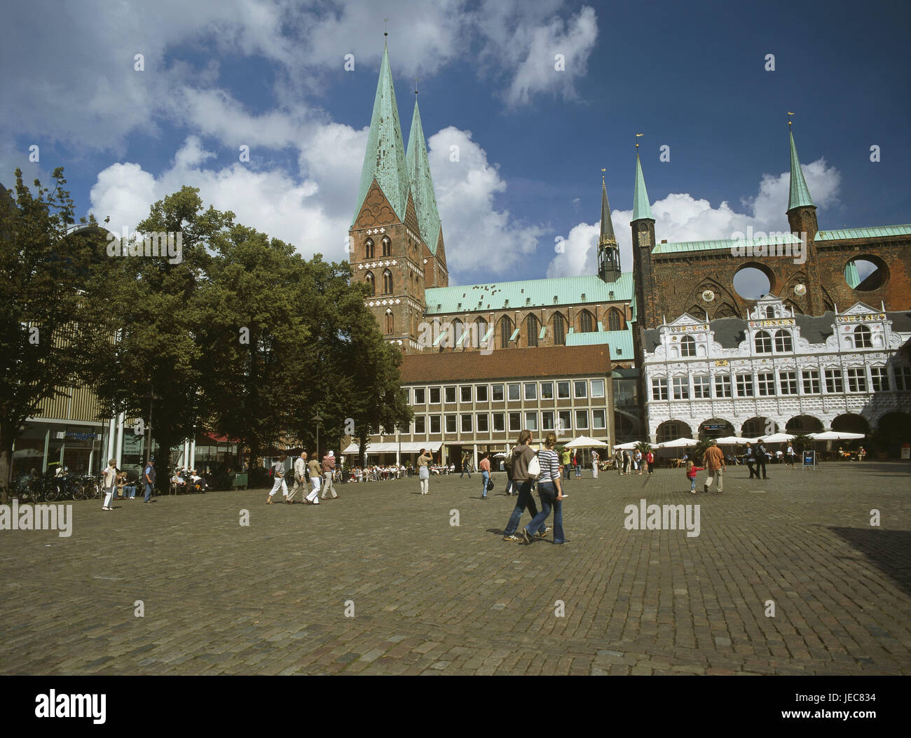 Germany, Schleswig - Holstein, Lübeck, Old Town, city hall, Renaissance bower, show wall, Marien's church, passer-by, North Germany, Hanseatic town, Old Town island, structures, architecture, historically, show wall, city hall building, square, brick building, brick, wind holes, turrets, broken through, to Renaissance foliage, Renaissance wing, sacred construction, church, brick Gothic, market, architecture, people, place of interest, UNESCO-world cultural heritage, outside, Stock Photo