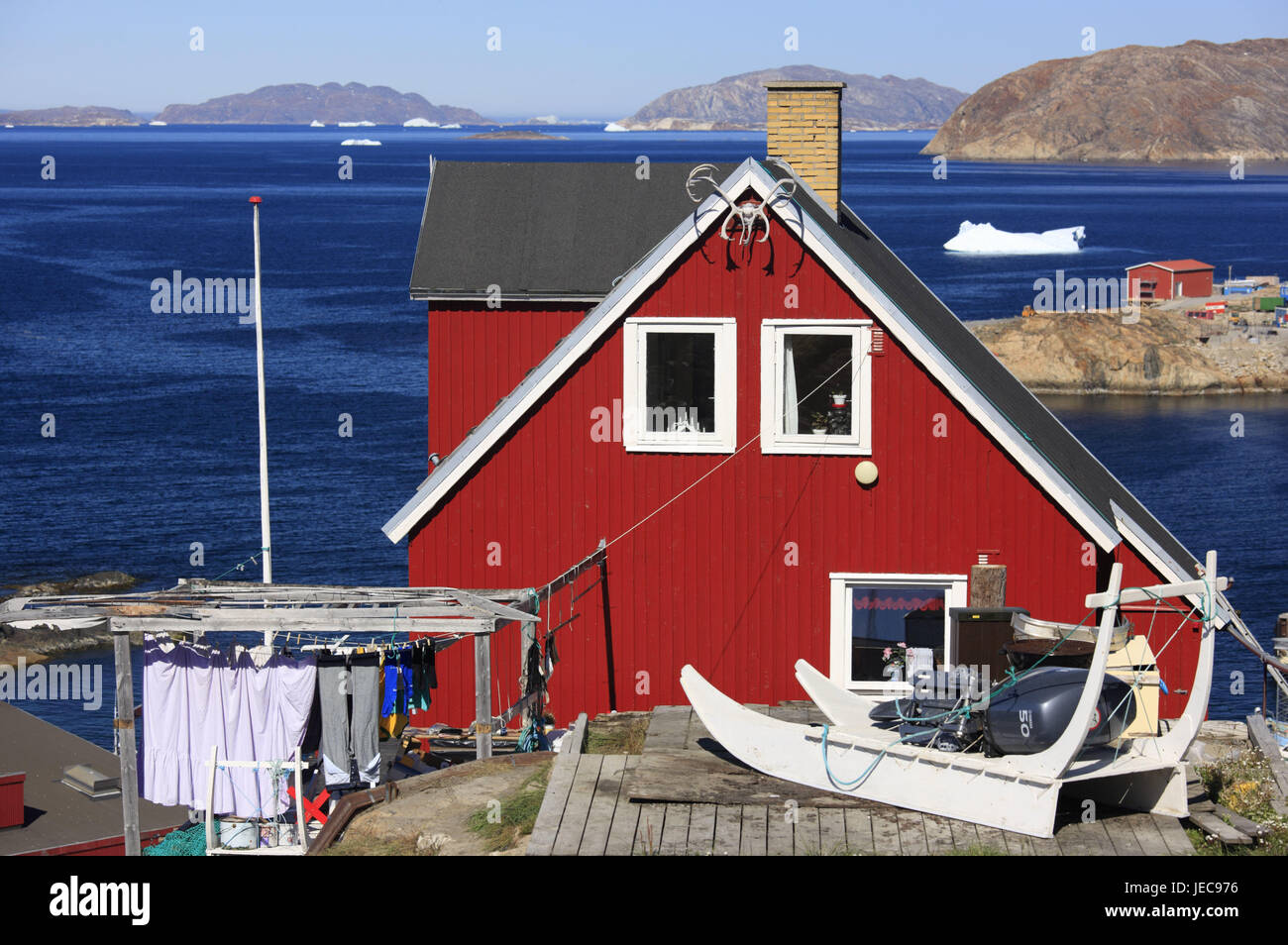 Greenland, Upernavik, wooden house, slide, clothes horse, background, sea, iceberg, North-Western Greenland, town, residential house, house, timber-frame construction way, red, typically for country, outside, deserted, the Arctic, water, view, rock, coast, coastal scenery, Stock Photo